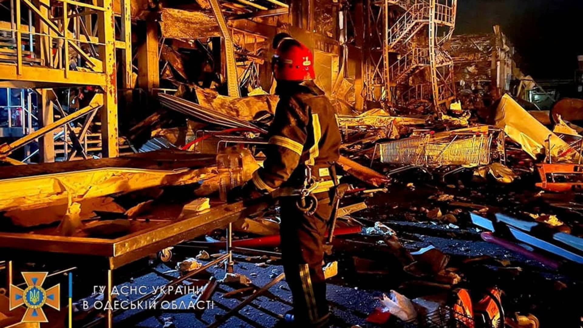 A first responder works at the site of a missile strike, amid Russia's invasion of Ukraine, in Odesa, Ukraine in this handout image released May 10, 2022. 