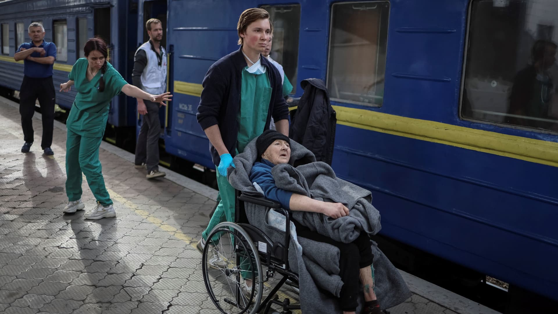 Medical workers get patients on a specially equipped train, run by Medicins Sans Frontieres (MSF) in collaboration with Ukraine's Ministry of Health and National Railways, to evacuate wounded people from war-affected areas of eastern Ukraine, amid Russia's invasion of the country, in Dnipro, Ukraine May 10, 2022. 