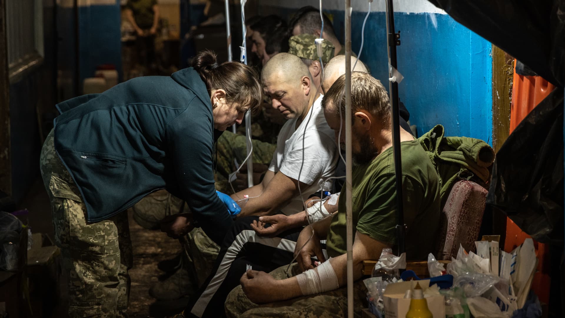Members of the Ukrainian military receive treatment for concussions and light injuries from Ukrainian military medics at a frontline field hospital on May 10, 2022 in Popasna, Ukraine.