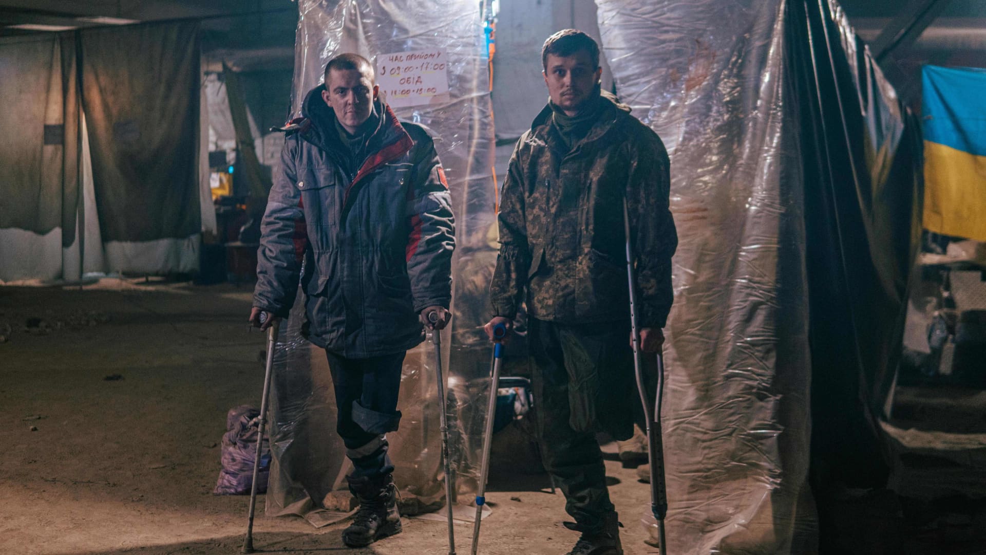 This photo released on May 10, 2022 by the Azov regiment shows two injured Ukrainian servicemen inside the Azovstal iron and steel works factory in eastern Mariupol, Ukraine, amid the Russian invasion. The Russian army is holding more than 3,000 civilians from Mariupol at a former penal colony near Olenivka in the Donetsk region of eastern Ukraine, according to a Ukrainian human rights official cited by the Associated Press.