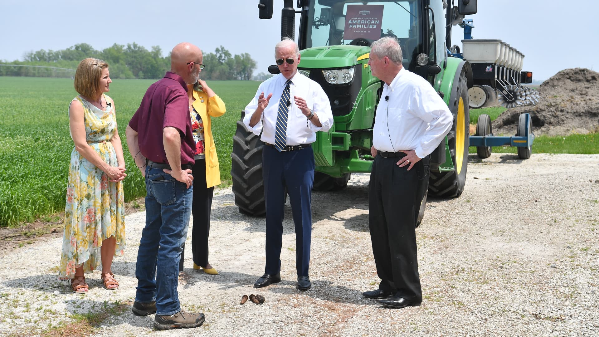 (L-R) Gina and Jeff O'Connor, owners of O'Connor Farms, US President Joe Biden, and US Agriculture Secretary Tom Vilsack speak while visiting O'Connor Farm in Kankakee, Illinois, on May 11, 2022.