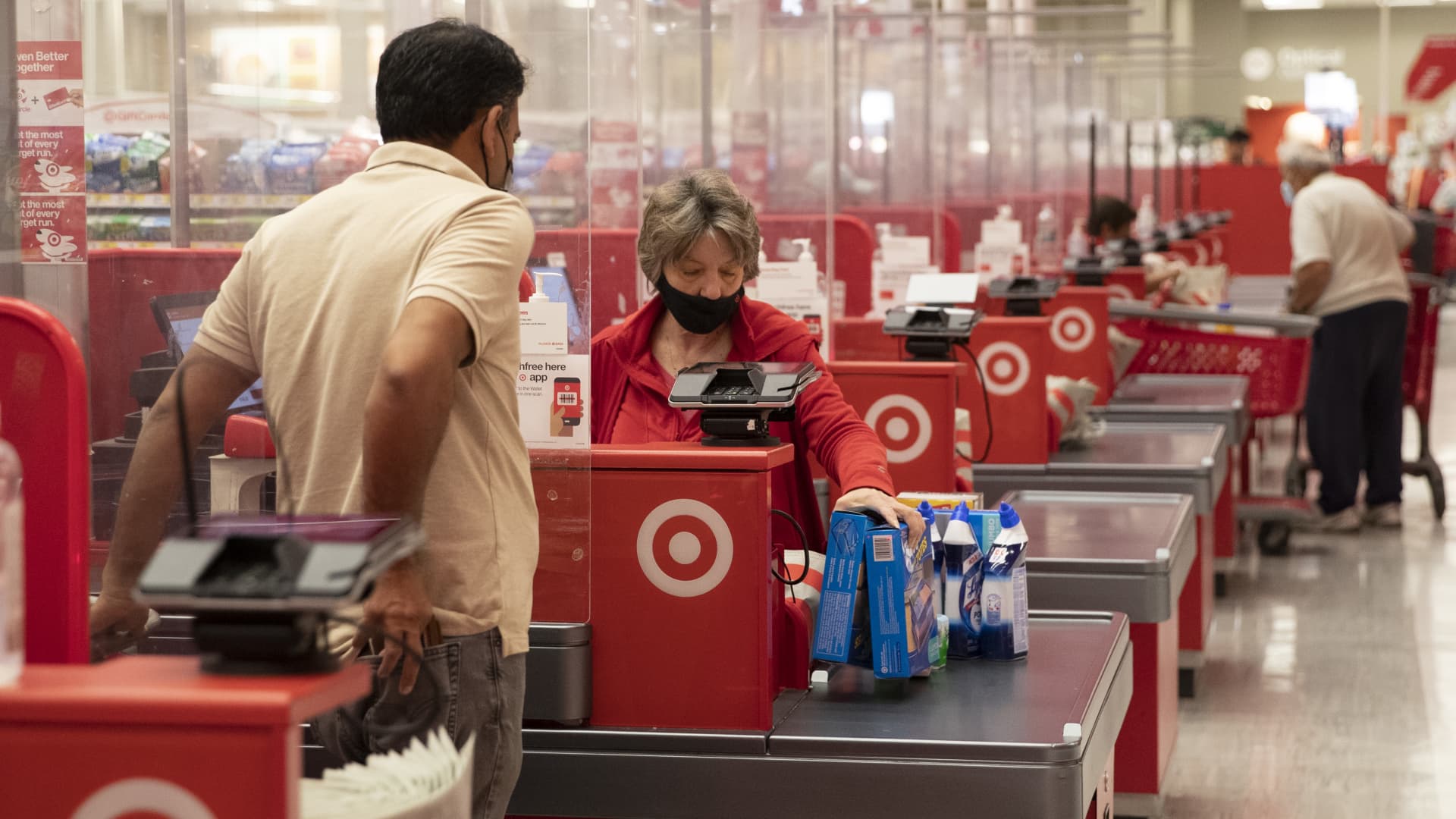 Employees assist customers at the checkout area of a supermarket on May 11, 2022 in New York City.