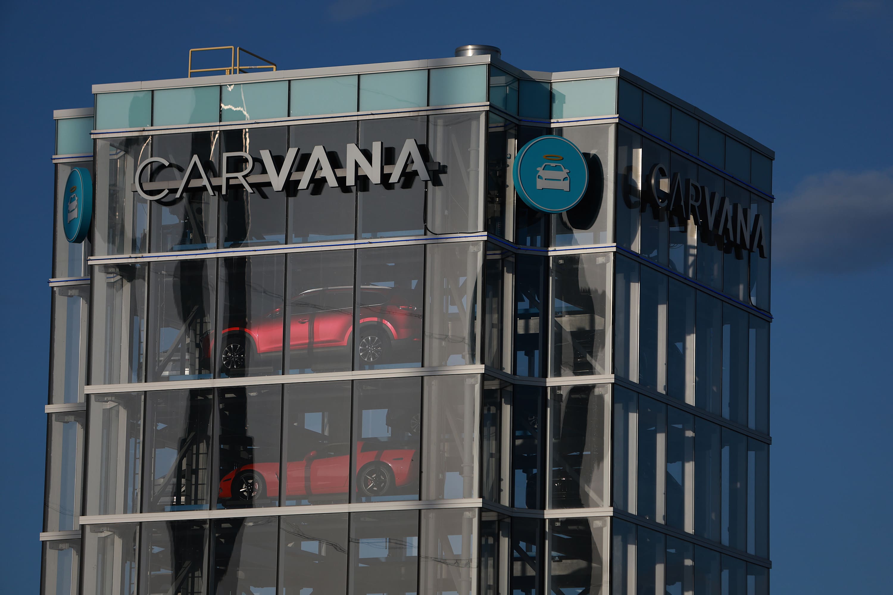 Stocks making the biggest moves midday: Carvana, Goldman Sachs, and AT&T