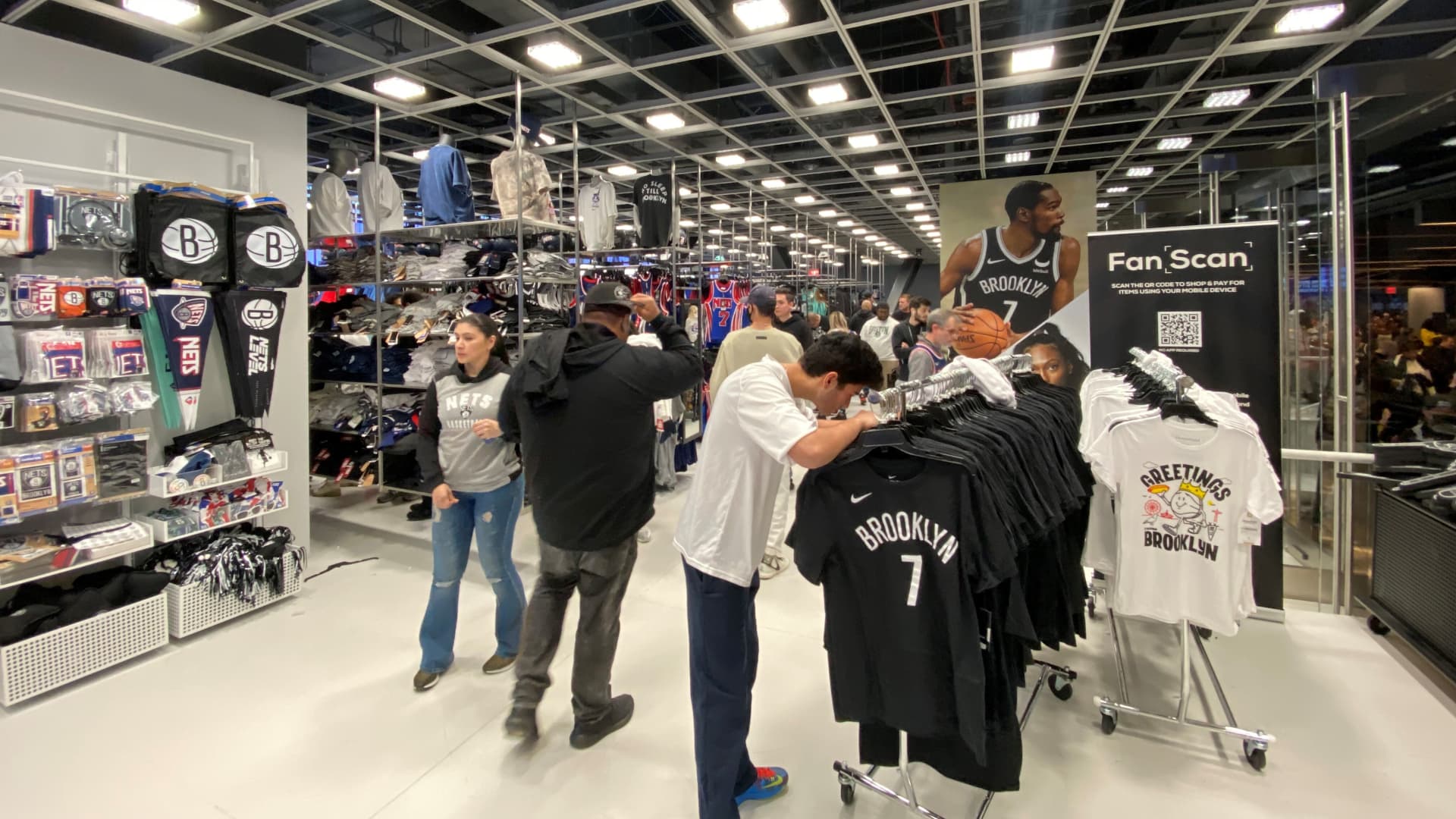 Sports fans shop at the Brooklyn Nets Fan shop at Barclays Center.