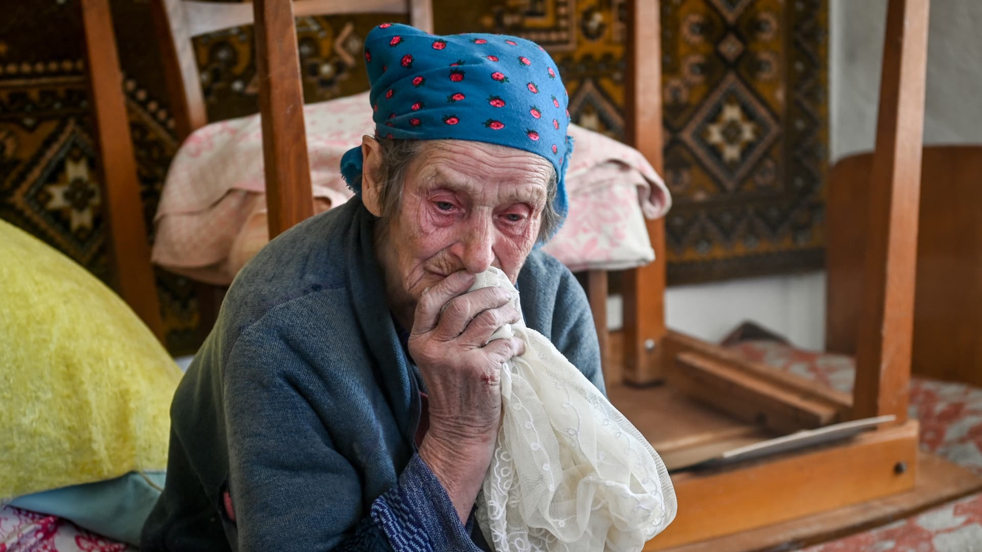 A Ukrainian woman cries in her house after the 18 missiles hit the civil settlements of Komyshuvakha, Zaporizhzhia Oblast, Ukraine on May 12, 2022.