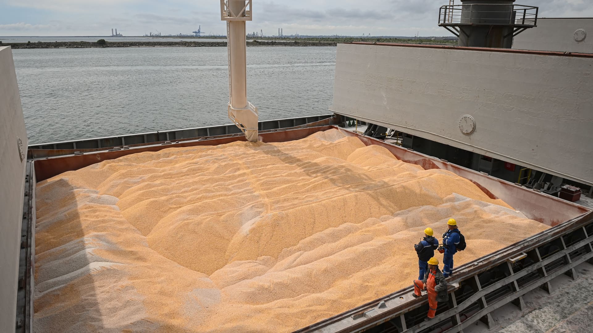 Workers assist the loading of corn on to a ship in the Black Sea port of Constanta, Romania on May 3, 2022. Russia's defense ministry is promising a safe corridor to let foreign ships leave Black Sea ports, the Associated Press reported.