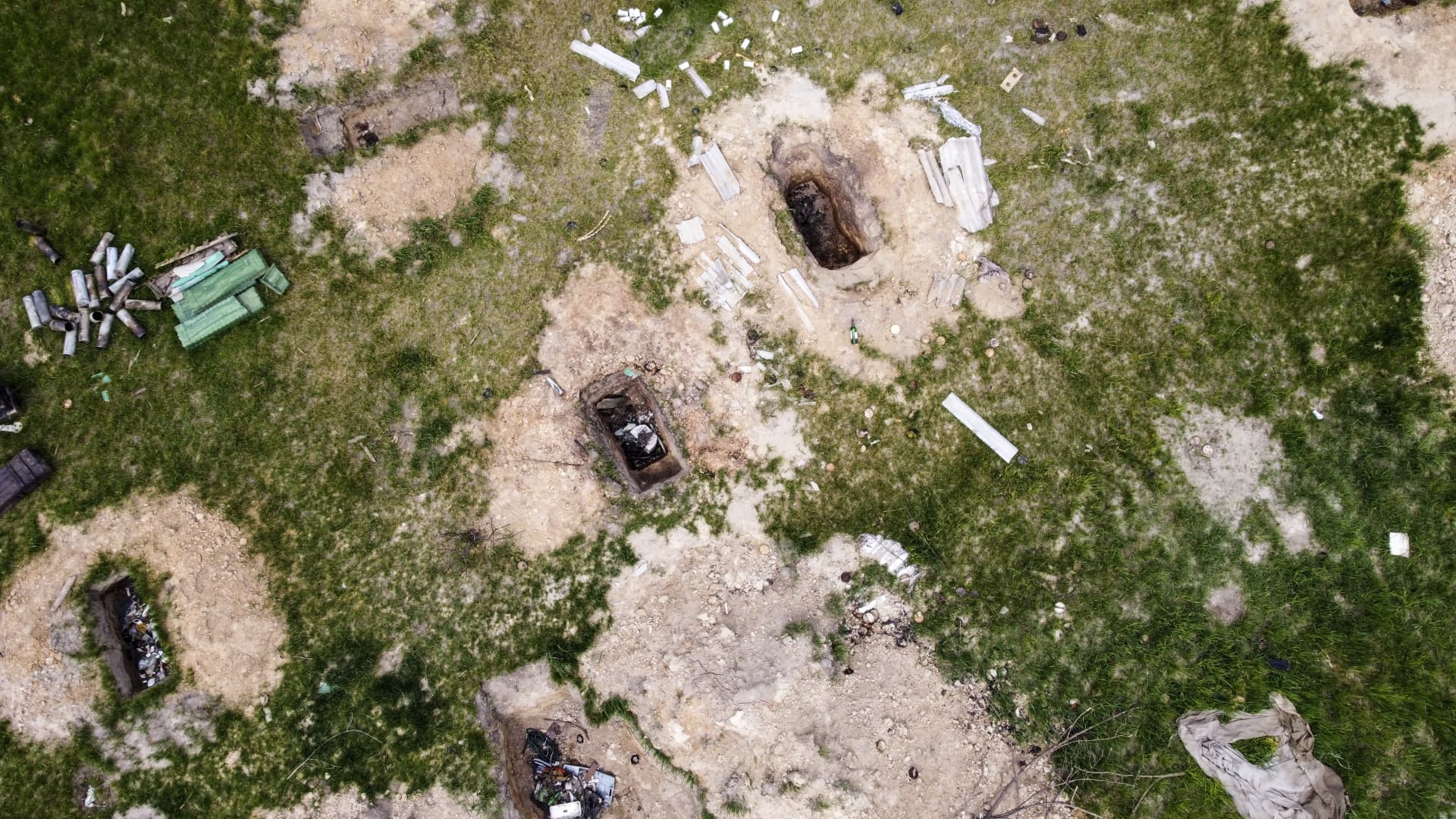 An aerial view of trenches left from the Russian soldiers next to the civilian houses are seen in Kozarovychi village, north of the city of Vishhorod, which was captured by the Russian army in the first days of the war, in Kyiv, Ukraine on May 14, 2022.
