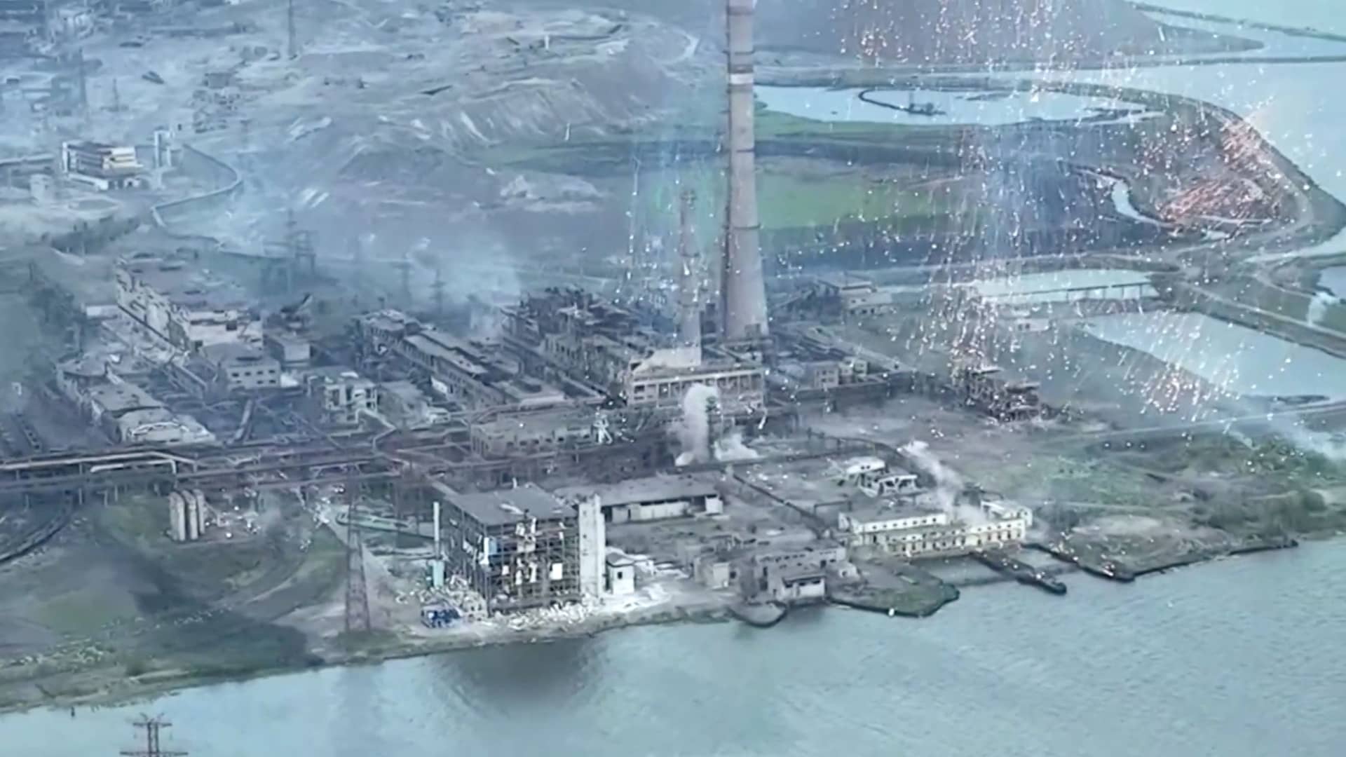 A screengrab from a video shows a shower of burning munitions hitting Azovstal steelworks in the Ukrainian port city of Mariupol, Ukraine. The video was obtained by Reuters on May 15, 2022.