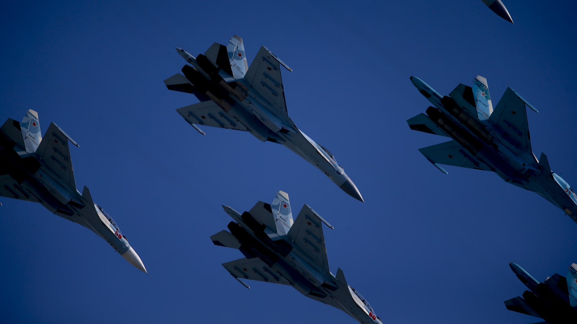 Russian Sukhoi Su-34, Sukhoi Su-35S and Sukhoi Su-30S fighter jets perform ahead of Victory Day in Red Square in Moscow.