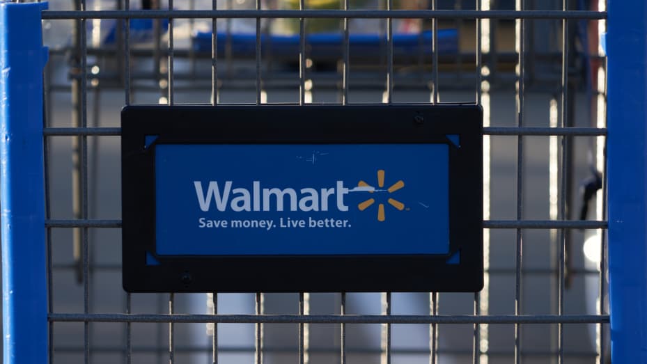 A shopping cart outside a Walmart store in Torrance, California, US, on Sunday, May 15, 2022. Walmart Inc. is scheduled to release earnings figures on May 17.