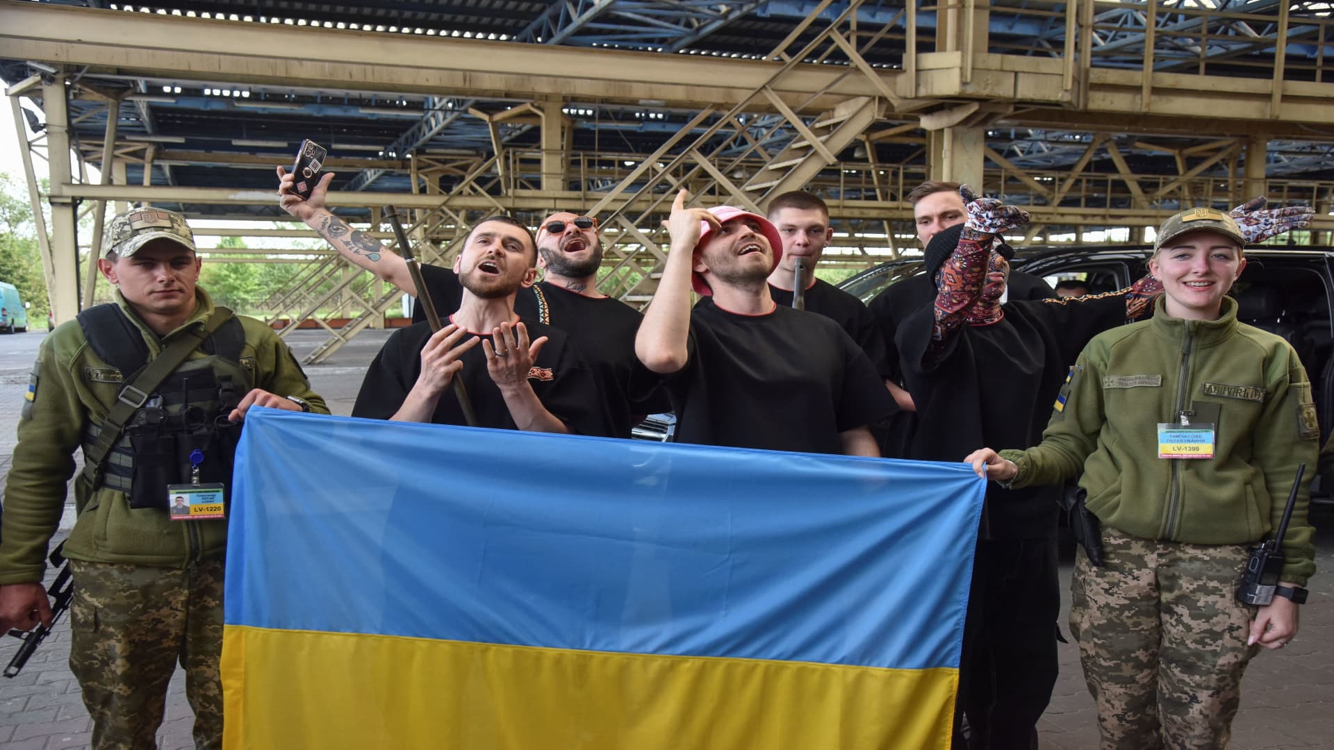 Kalush Orchestra, the winners of the 2022 Eurovision Song Contest, perform for the members of Ukraine's State Border Guard Service as they arrive at the Ukraine-Poland border crossing point near the village of Krakovets, in Lviv region, Ukraine May 16, 2022. 