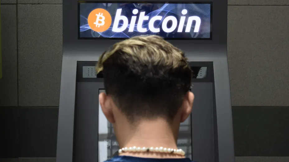 A bystander uses a Bitcoin ATM in San Salvador, El Salvador, on May 16, 2022.