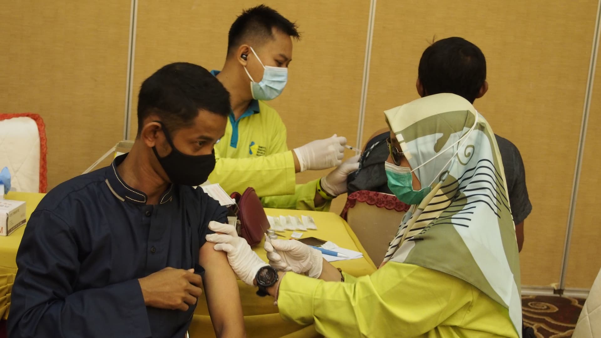 India emerged as a large supplier of Covid-19 vaccines, supplying to 75 countries, including Indonesia, where a medical officer injects the vaccine AstraZeneca into a recipient in Bintan island on July 2, 2021.