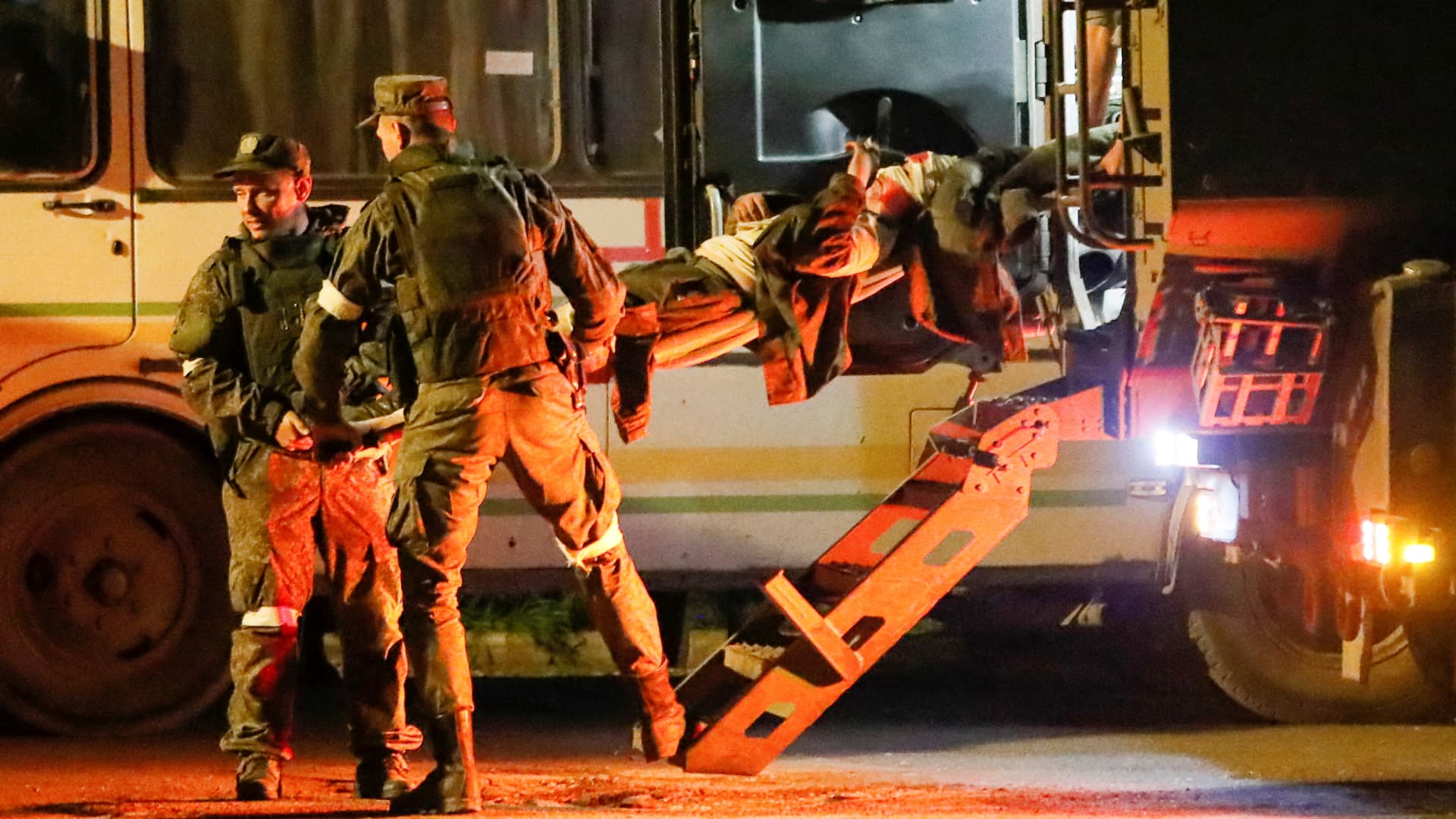 A wounded service member of Ukrainian forces from the besieged Azovstal steel mill in Mariupol is transported on a stretcher out of a bus, which arrived under escort of the pro-Russian military in the course of Ukraine-Russia conflict in Novoazovsk, Ukraine May 16, 2022. 