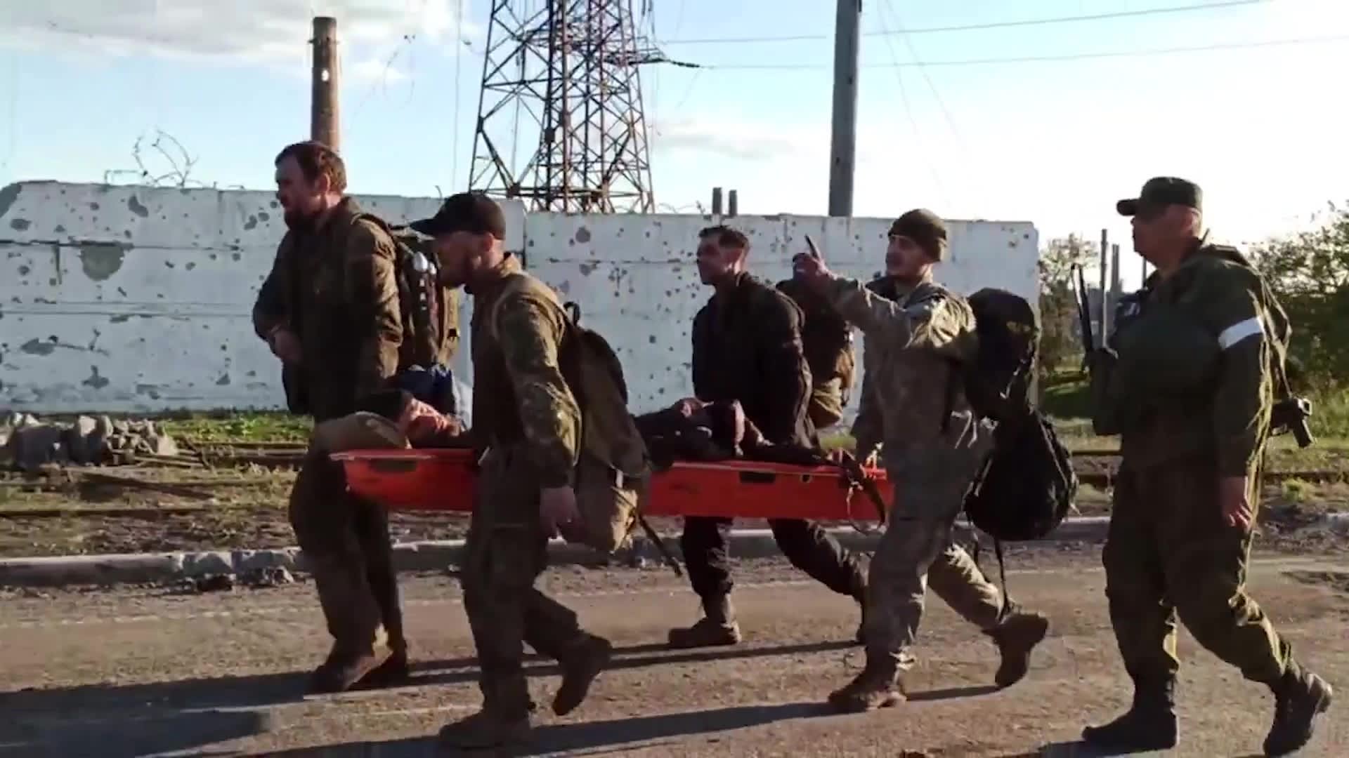 A screen grab taken from a video released by Russian Defense Ministry shows Ukrainian soldiers are being evacuated from Azovstal steel plant in the port city of Mariupol, Ukraine on May 17, 2022.