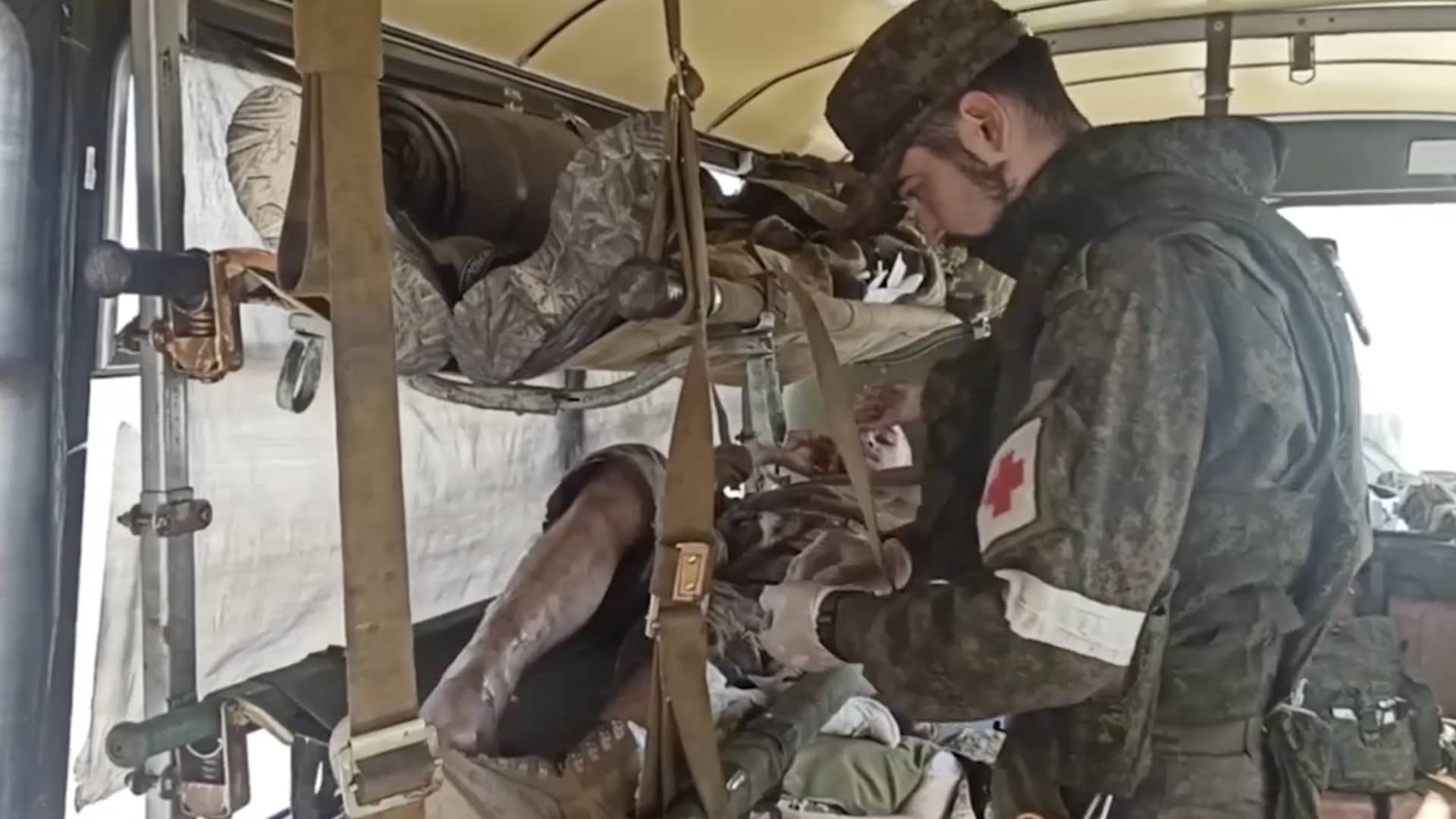 In this photo taken from a video released by the Russian Defense Ministry Press Service on Tuesday, May 17, 2022, wounded Ukrainian servicemen are seen in a bus as they are evacuated from the Azovstal steel plant in Mariupol, Ukraine.