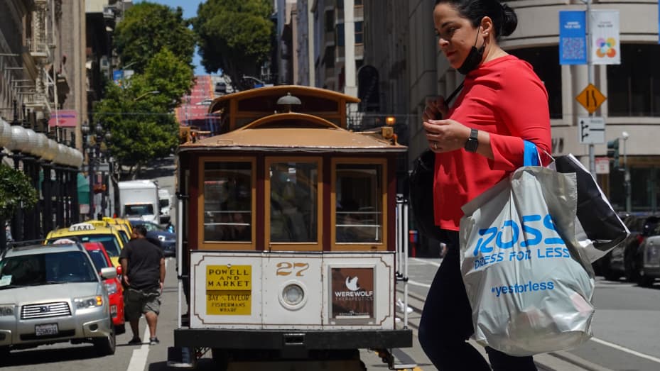 A pedestrian carries a shopping bag while walking through Union Square on May 17, 2022 in San Francisco, California.