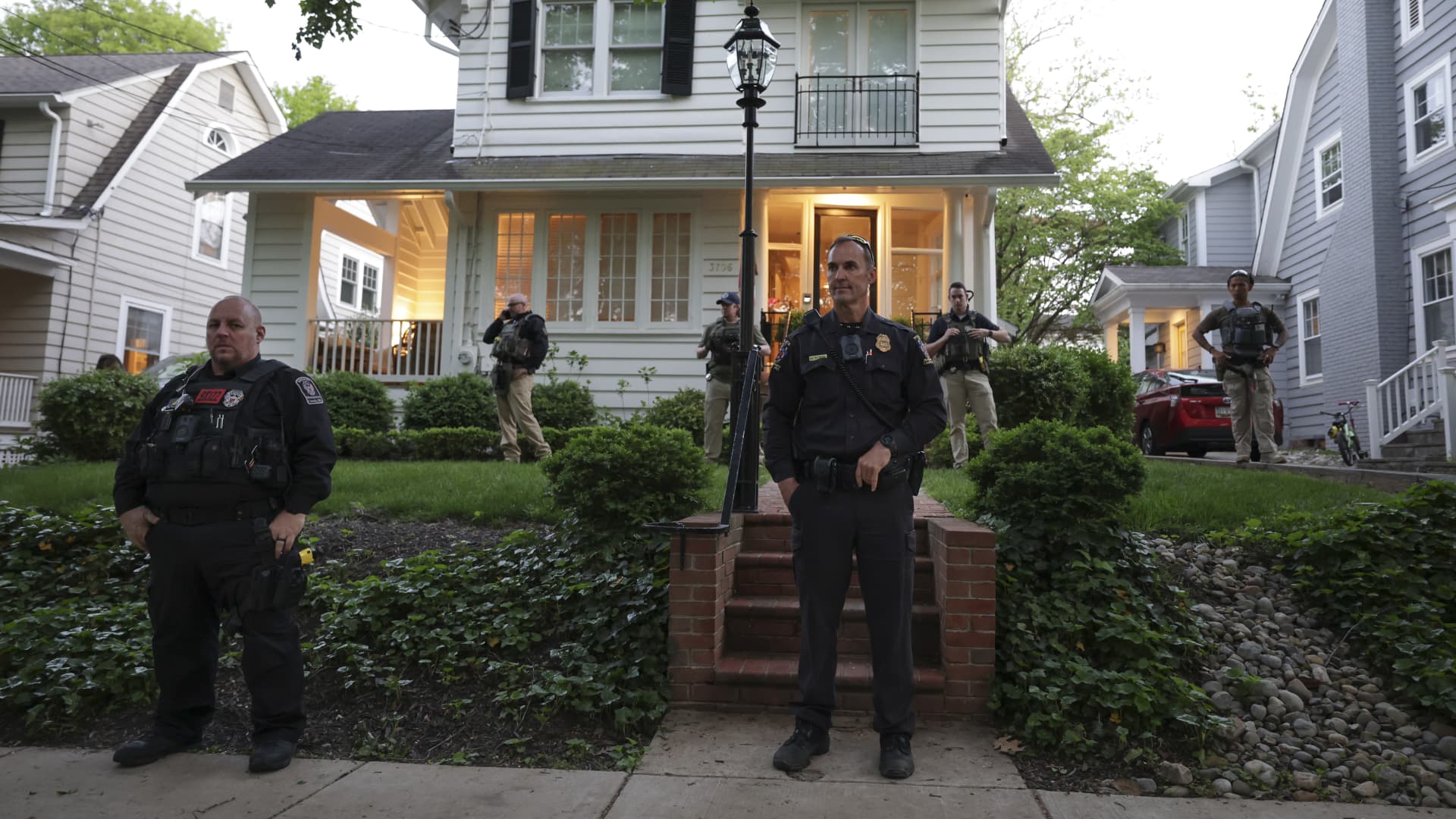 Police stand outside the home of U.S. Associate Justice Brett Kavanaugh as abortion-rights advocates protest on May 11, 2022 in Chevy Chase, Maryland.