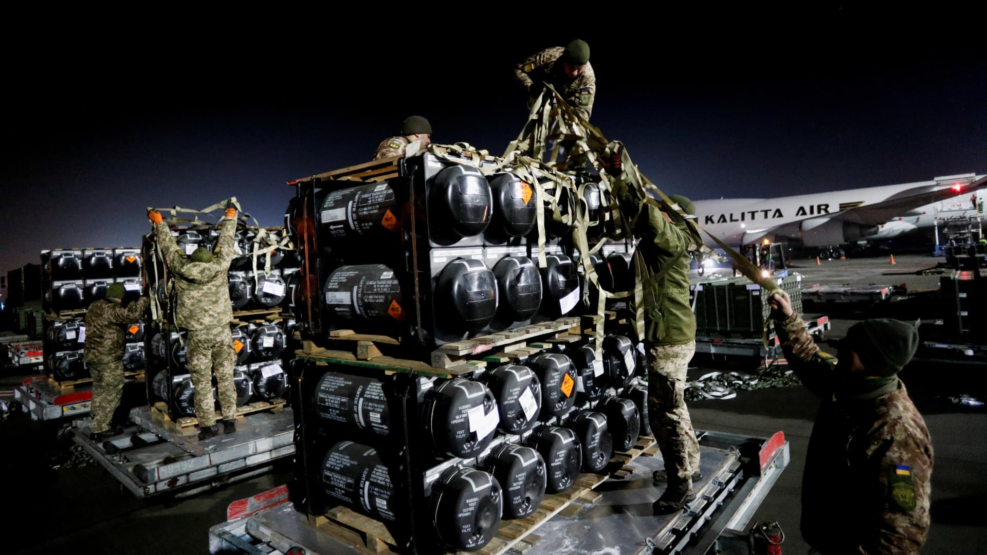 Ukrainian service members unpack Javelin anti-tank missiles, delivered by plane as part of a U.S. military support package for Ukraine, at the Boryspil International Airport outside Kyiv, Ukraine, on Feb. 10, 2022.