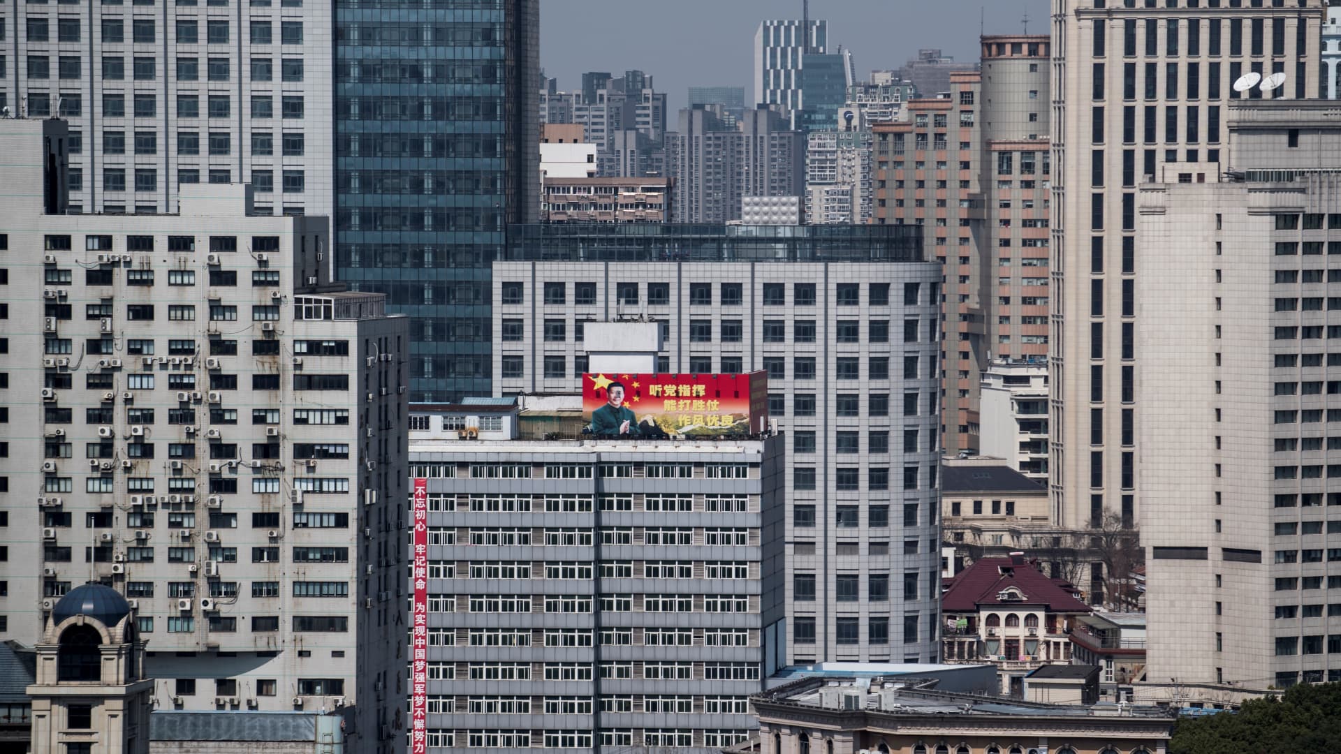 High-rise buildings in downtown Shanghai, China, on March 12, 2018. China cut its benchmark reference rate for mortgages by an unexpectedly wide margin on Friday, its second cut this year as Beijing seeks to revive the ailing housing sector to prop up the economy.