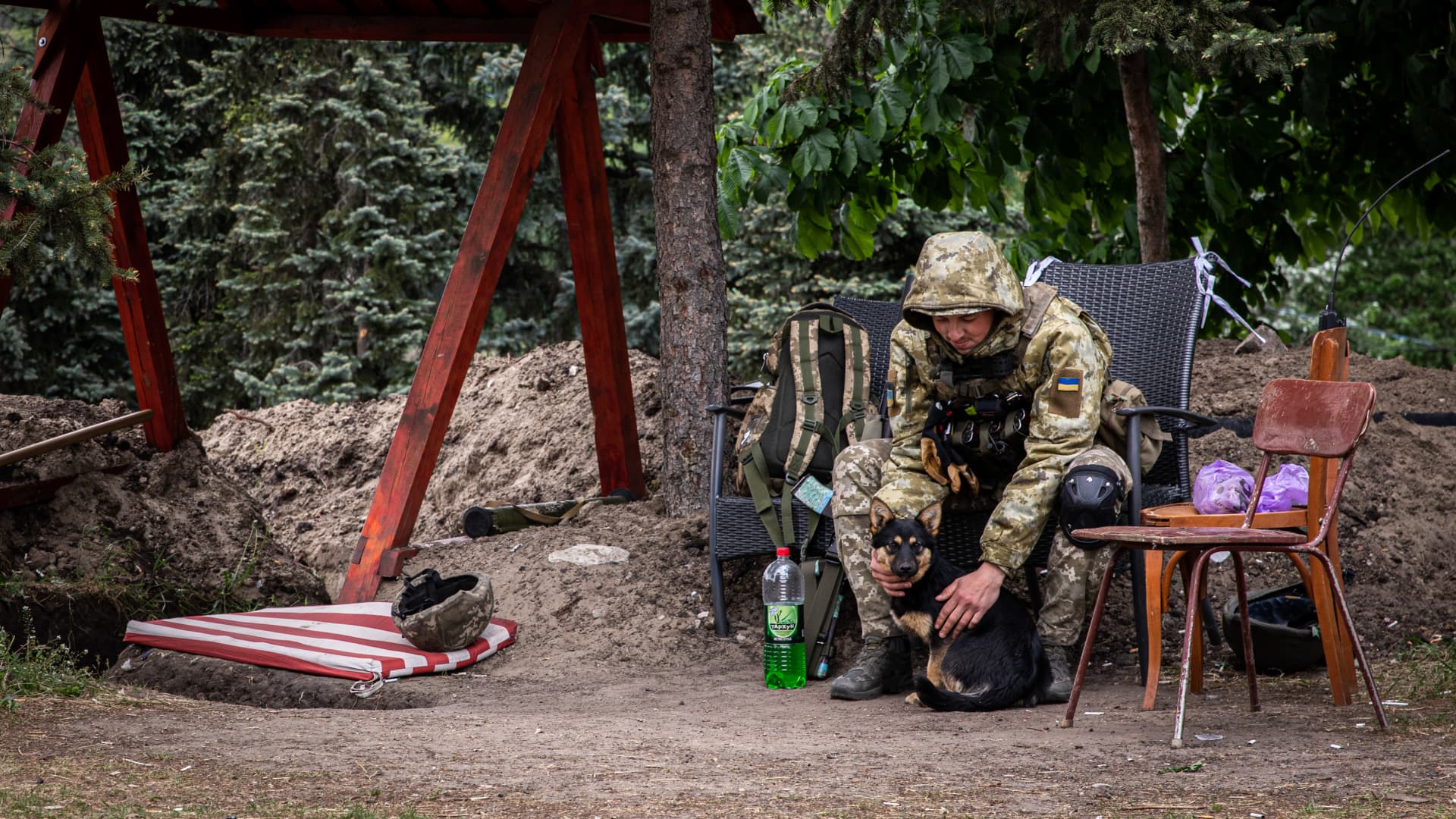 A Ukrainian soldier is patting his dog while resting at an undisclosed defense position on the outskirt of the separatist region of Donetsk (Donbas). Donetsk (Donbas) region is under heavy attack from the Russian troops.
