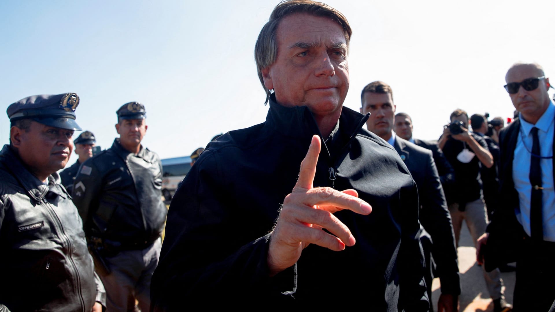 Brazil's president Jair Bolsonaro gestures as he arrives at a hotel to participate in a news conference about the Amazon rainforest and to meet with Elon Musk, according to ministers, in Porto Feliz, Sao Paulo state, Brazil May 20, 2022.