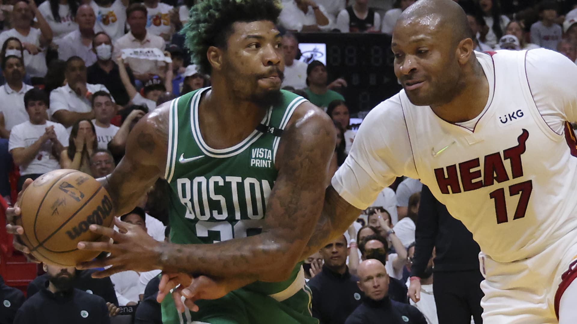 Boston Celtics guard Marcus Smart (36) is fouled by Miami Heat forward P.J. Tucker (17) during the first quarter. The Miami Heat host the Boston Celtics during game 2 in the NBA Eastern Conference Finals at FTX Arena in Miami, FL on May 19, 2022.