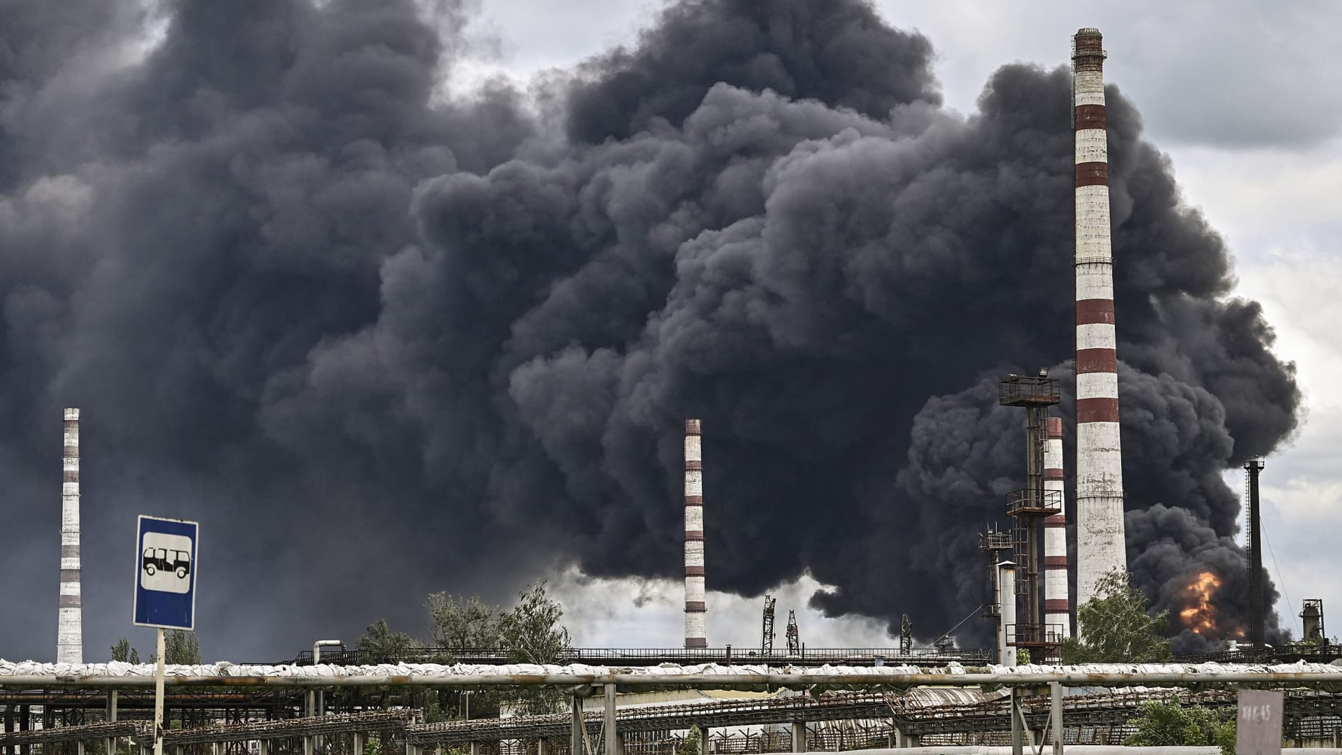 Smoke rises from an oil refinery after an attack outside the city of Lysychansk in the eastern Ukranian region of Donbas, on May 22, 2022, on the 88th day of the Russian invasion of Ukraine.