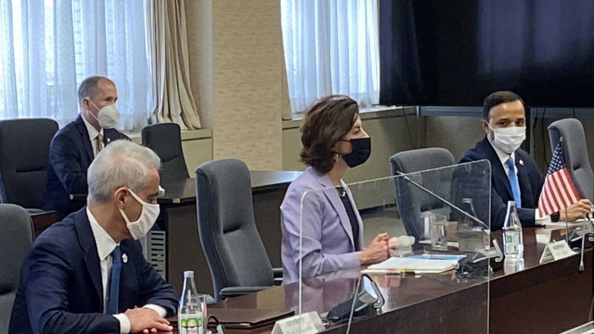U.S. Commerce Secretary Gina Raimondo, center, met on Monday in Tokyo with Japan's trade minister, Koichi Hagiuda. The two democracies are working to shore up their alliance against a backdrop of economic uncertainty around the world. U.S. Ambassador to Japan Rahm Emanuel is at left.