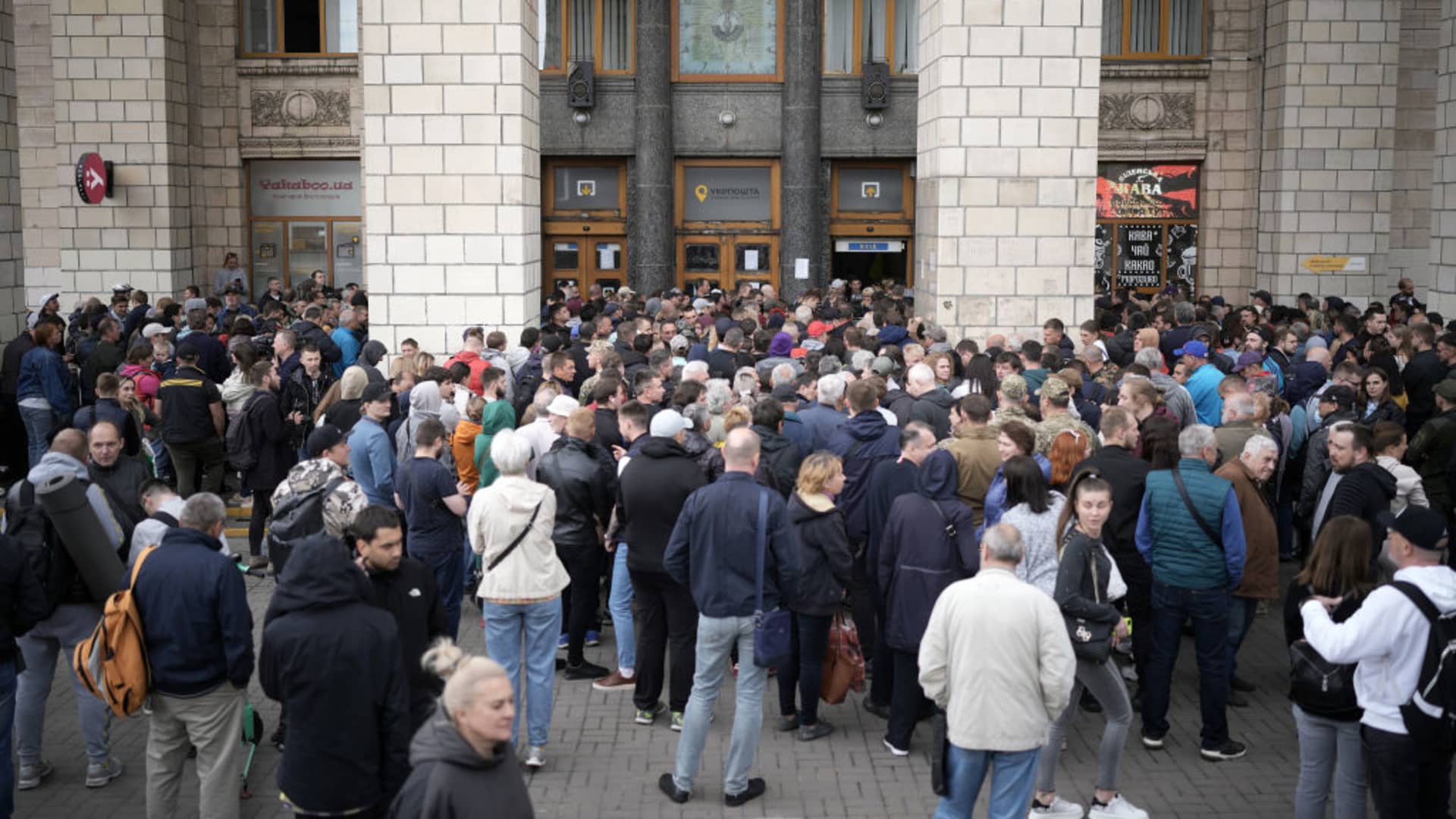 Hundreds of people queue at Kyiv central post office for a new Ukrainian postal service stamp marking the sinking of Russian warship Moskva on May 23, 2022 in Kyiv, Ukraine.