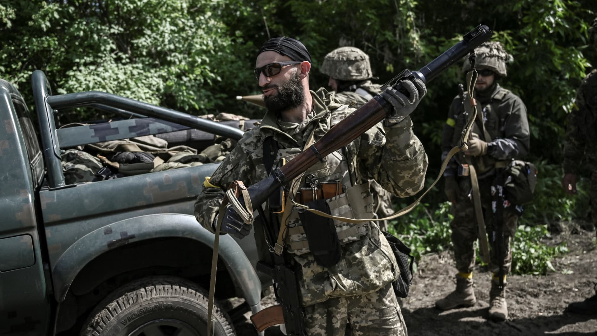 Ukrainian servicemen get ready to move toward the frontline at a checkpoint near the city of Lysychansk in the eastern Ukranian region of Donbas, on May 23, 2022, amid Russian invasion of Ukraine.