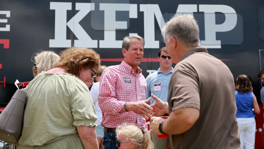 Georgia Gov. Brian Kemp greets people as he campaigns during a Get Out the Vote cookout at the Hadden Estate at DGD Farms on May 21, 2022 in Watkinsville, Georgia.