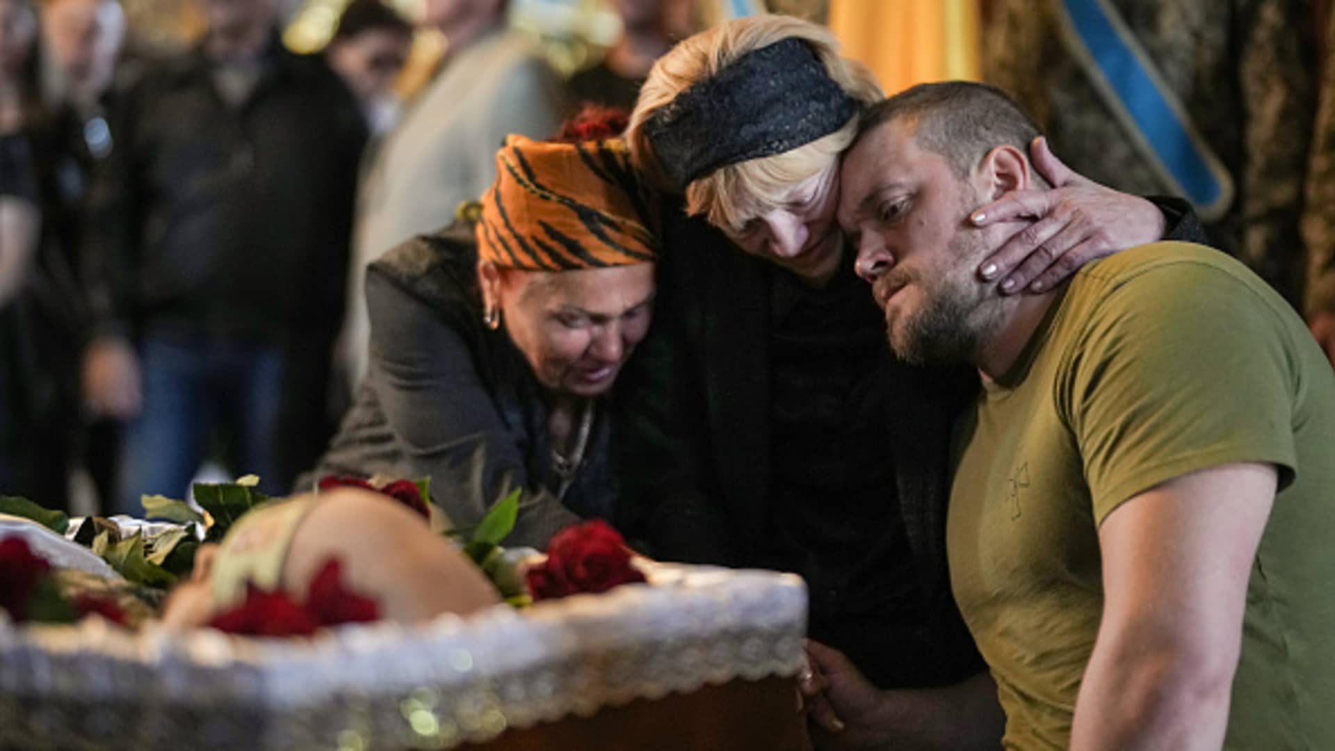 Relatives, friends and comrades of Ukrainian soldier Eduardo Trepilchenko, who was killed on the Eastern front battling the Russian invasion, attend his funeral at St Michael's Cathedral on May 25, 2022 in Kyiv, Ukraine.