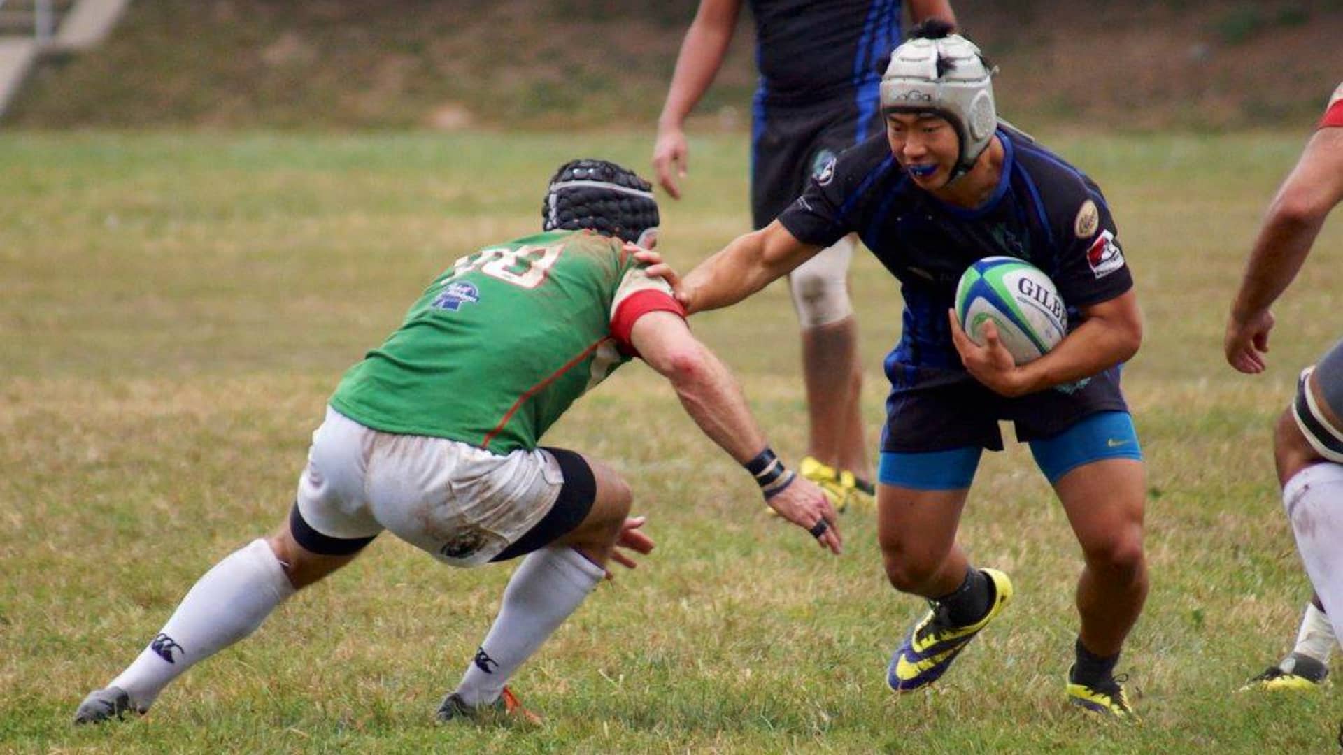 Brian Jung, in high school, playing rugby.