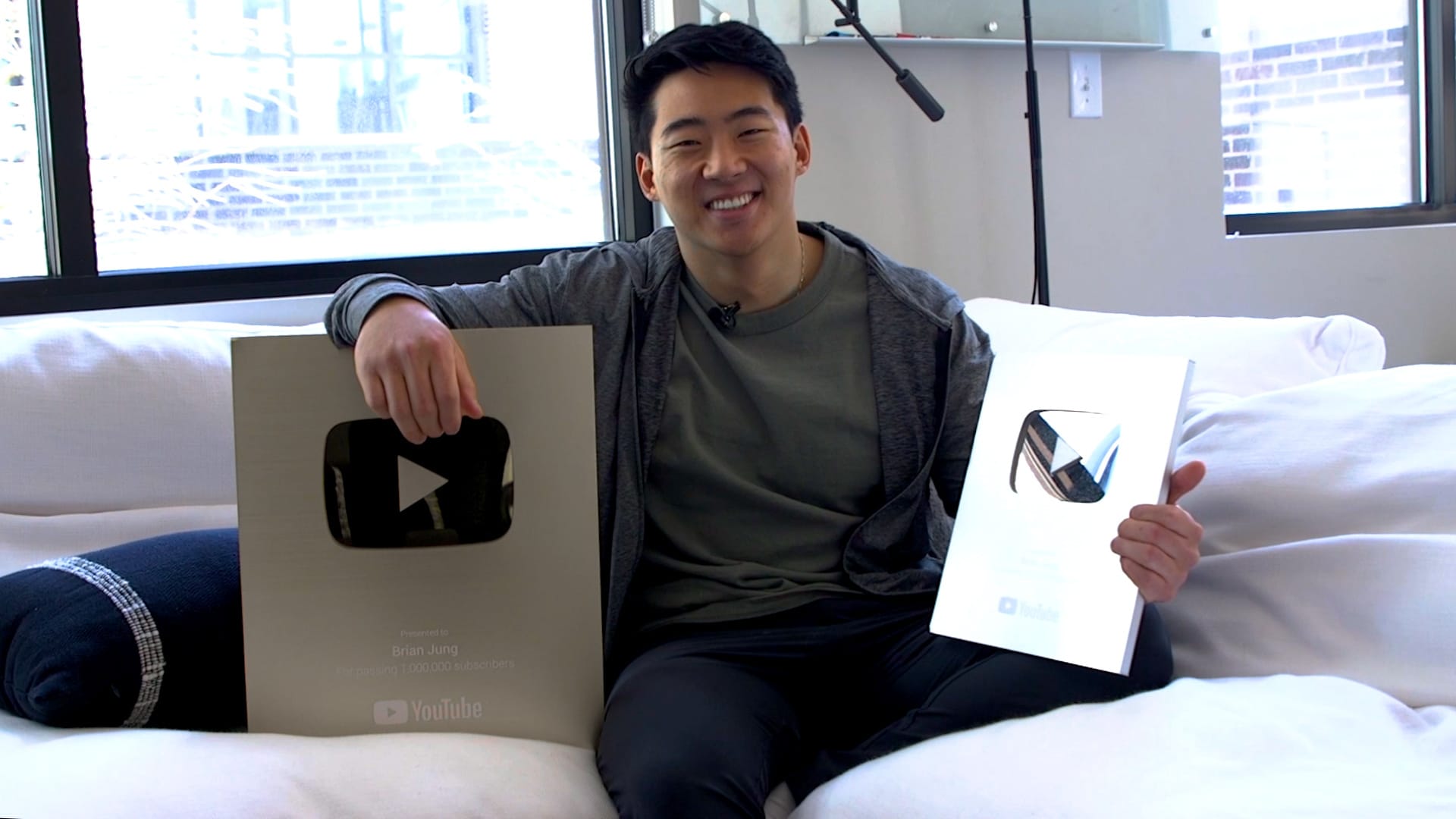 Brian Jung poses with his YouTube Creator Awards.