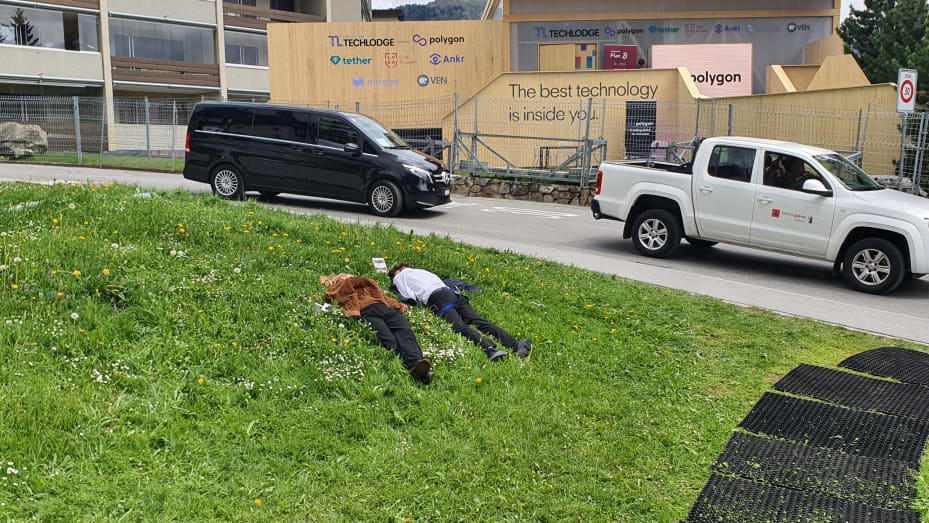 Waiters working at events just outside the main congress center in Davos took the opportunity to nap on the grass.