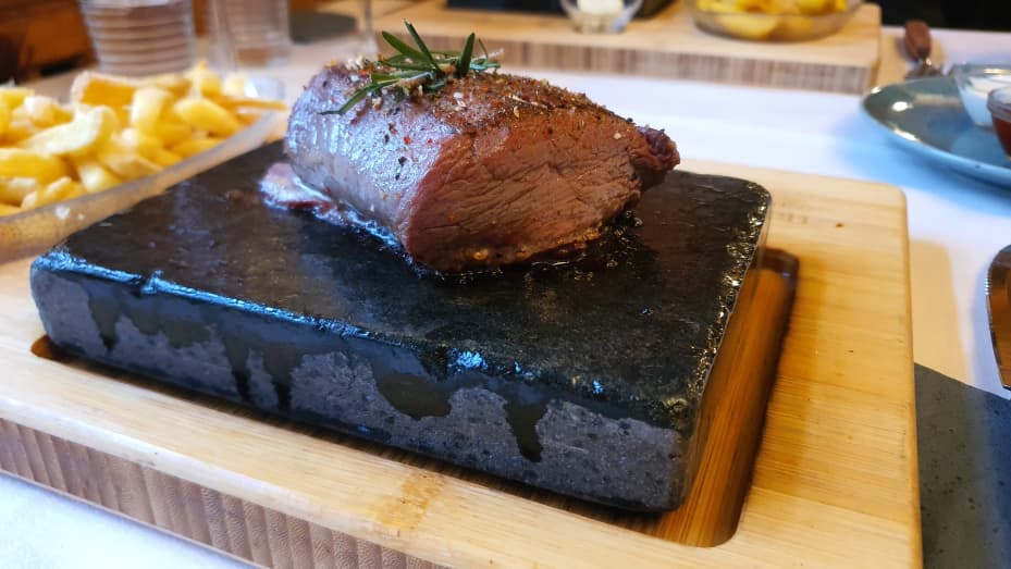 The famous hot stone at Steakhouse Ochsen. The meat is cooked on the hot stone while you eat.