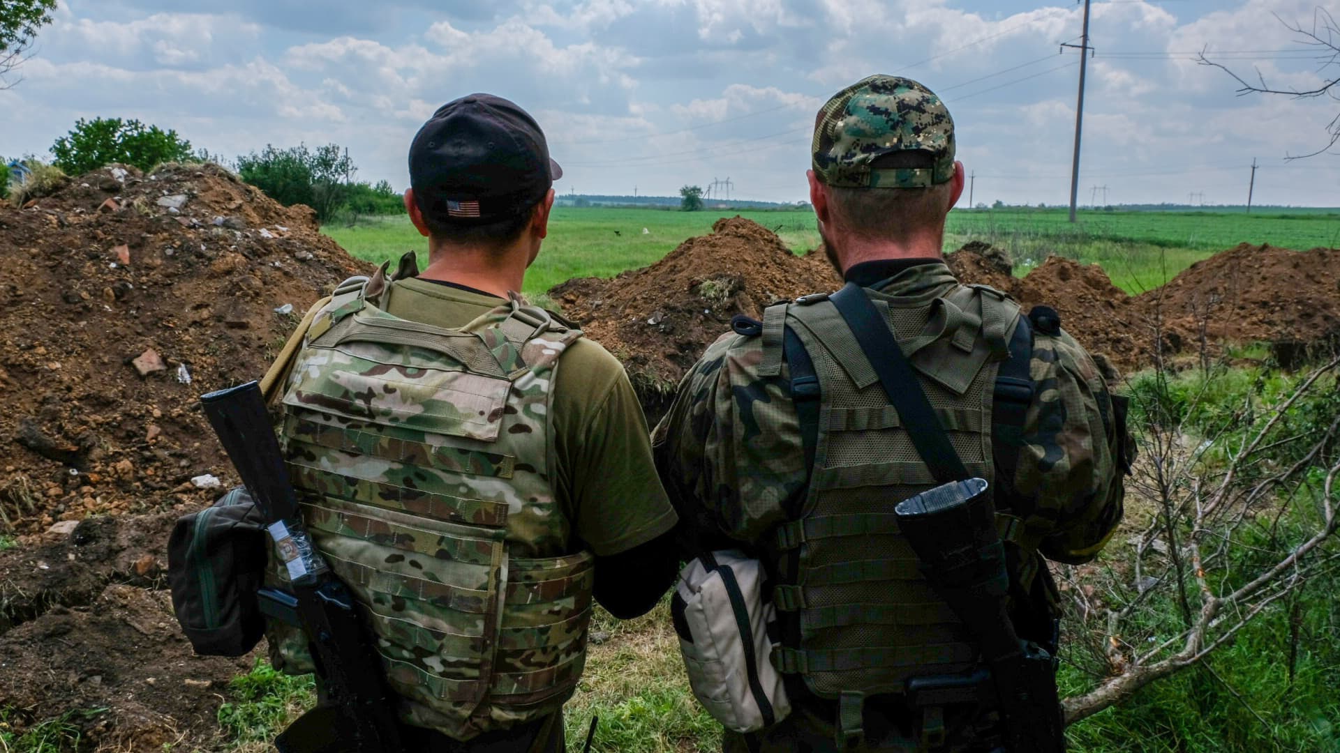 Two Ukrainian soldiers look at the southern front line.