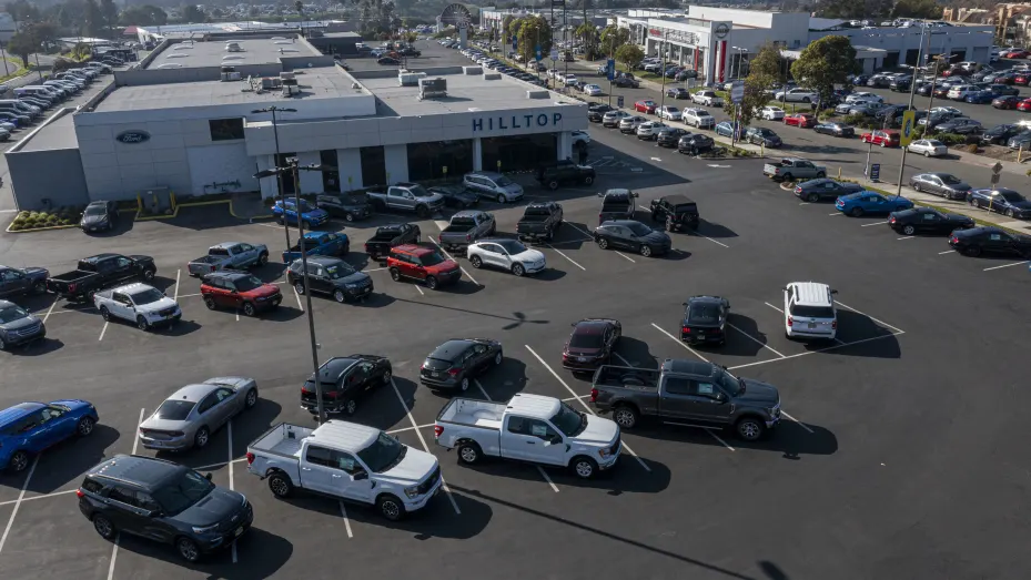 A Ford dealership in Richmond, California, U.S., on Wednesday, Jan. 26, 2022. U.S. auto sales will climb just 3.4% this year to 15.4 million cars and trucks as the semiconductor shortages continue to constrain vehicle inventory, auto dealers predict. Photographer: David Paul Morris/Bloomberg via Getty Images