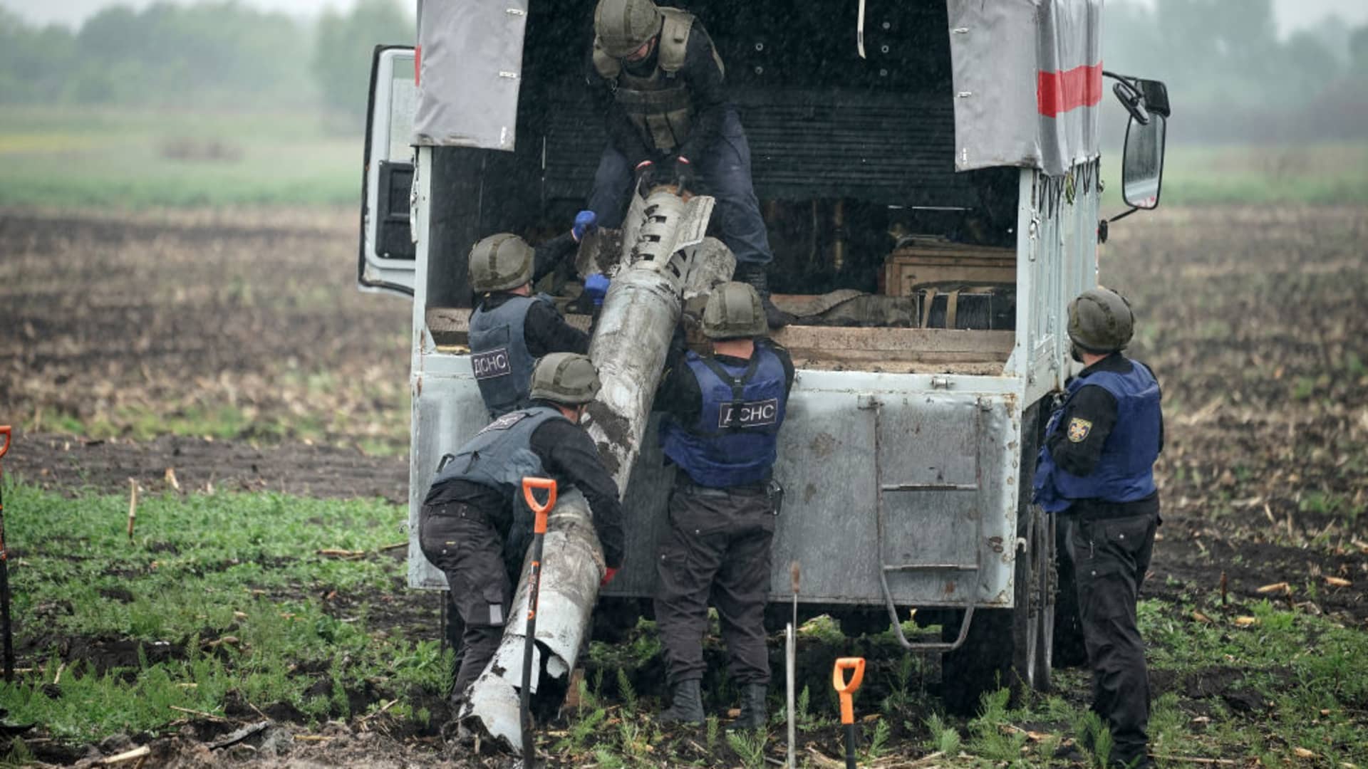 Bomb disposal experts from the Ukrainian State Emergency Service make safe a Russian BM-30 Smerch rocket and remove it from a field on May 31, 2022 in Borodianka, Ukraine. 