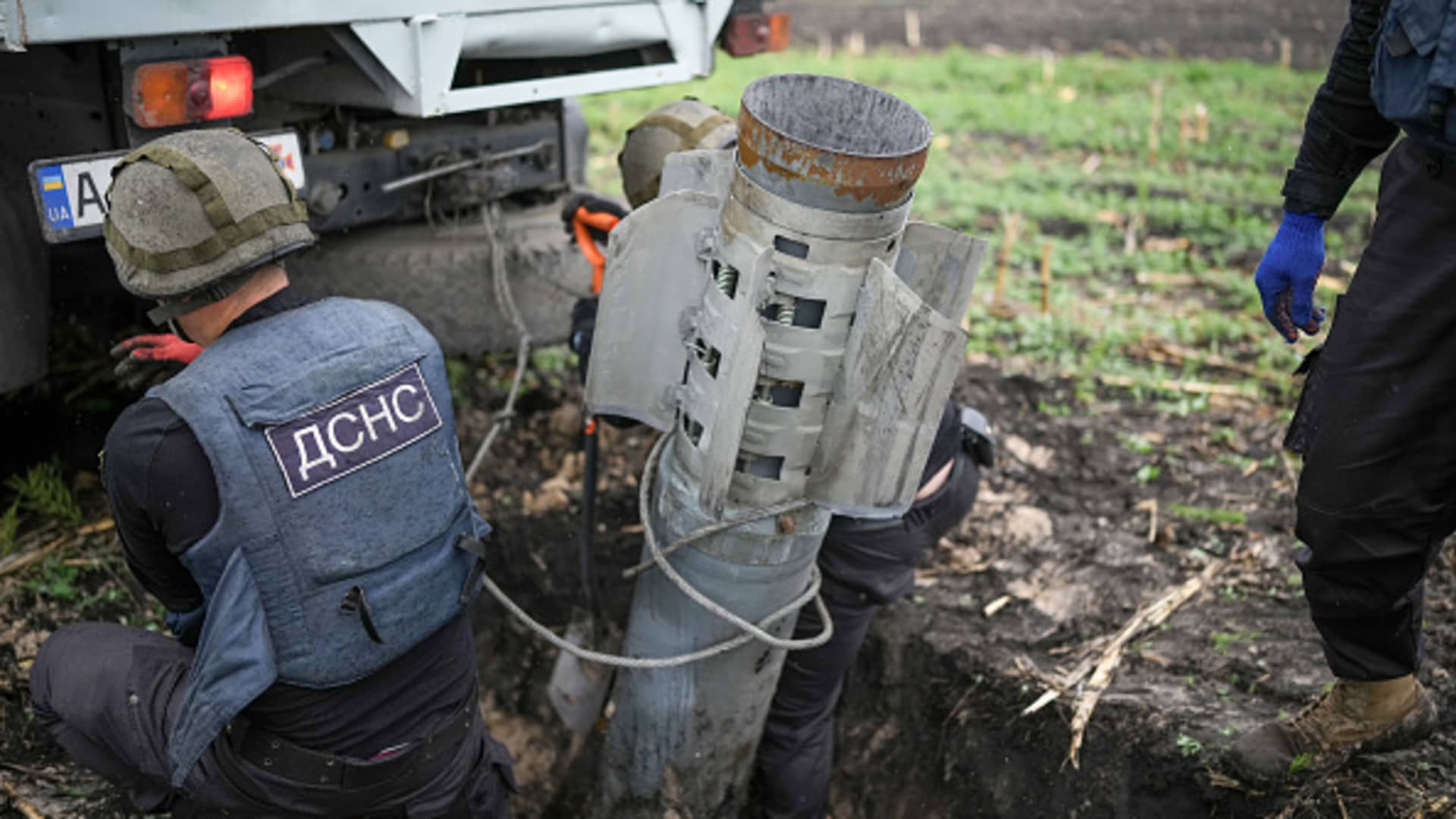 Bomb disposal experts from the Ukrainian State Emergency Service make safe a Russian BM-30 Smerch rocket and remove it from a field on May 31, 2022 in Borodianka, Ukraine.