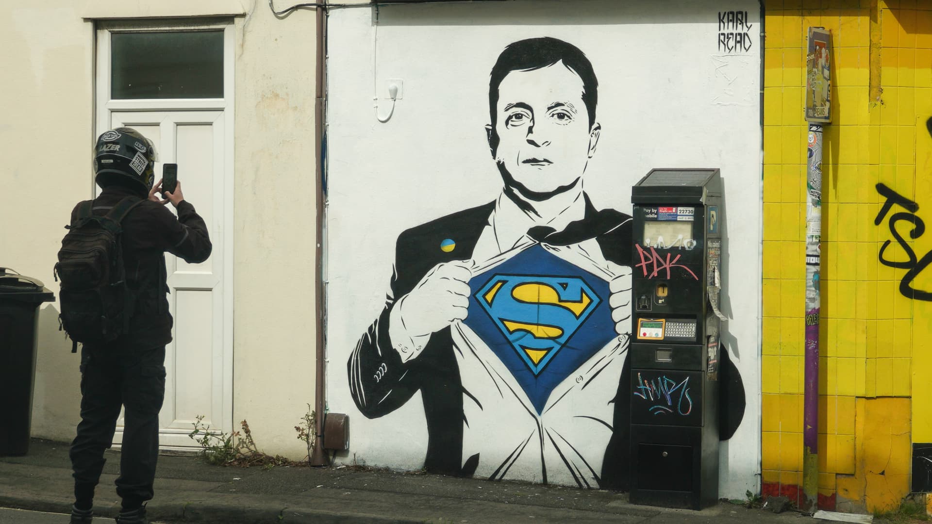 Artwork of Ukrainian president Volodymyr Zelenskyy being portrayed as Superman is seen on a wall of a shop, on May 15, 2022 in Bristol, England.