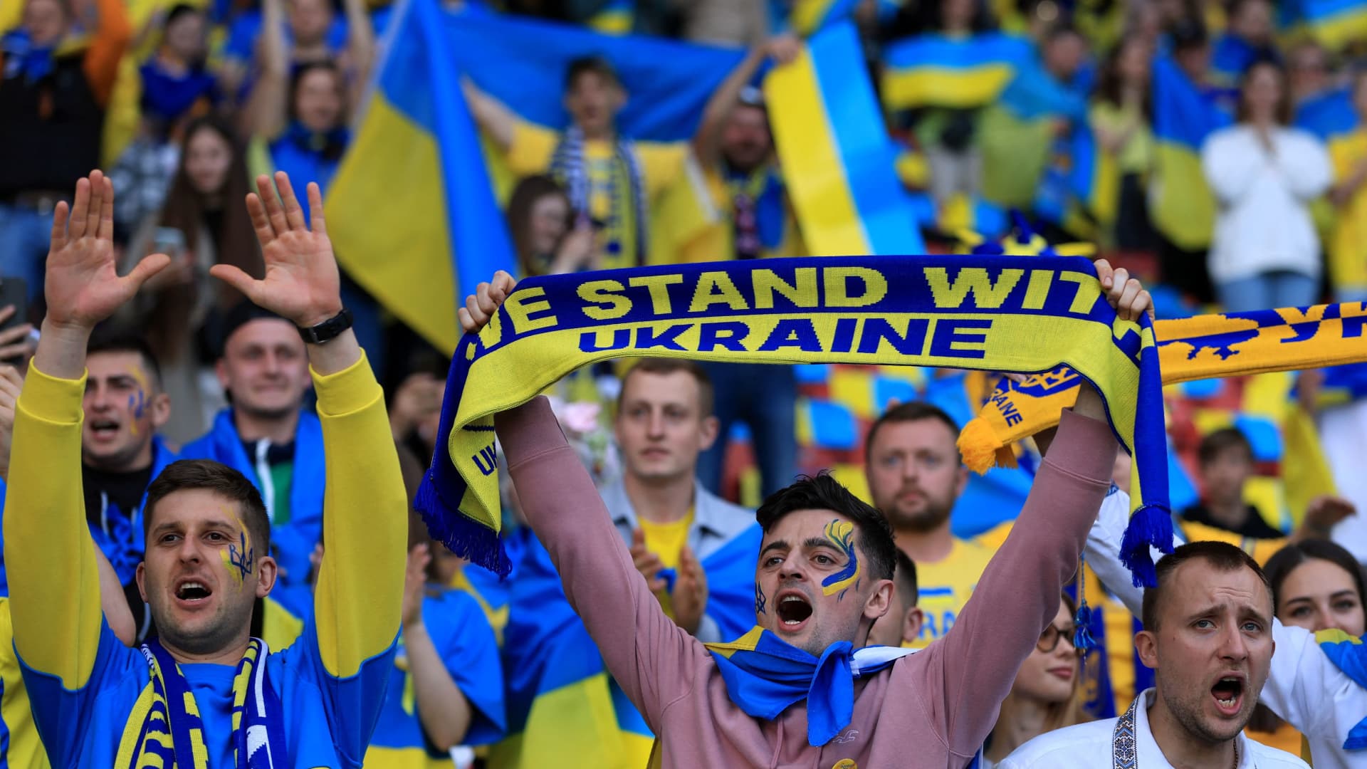 Ukrainian fans cheer inside the stadium before a football playoff semifinal against Scotland at Hampden Park in Glasgow, Scotland, on June 1, 2022.