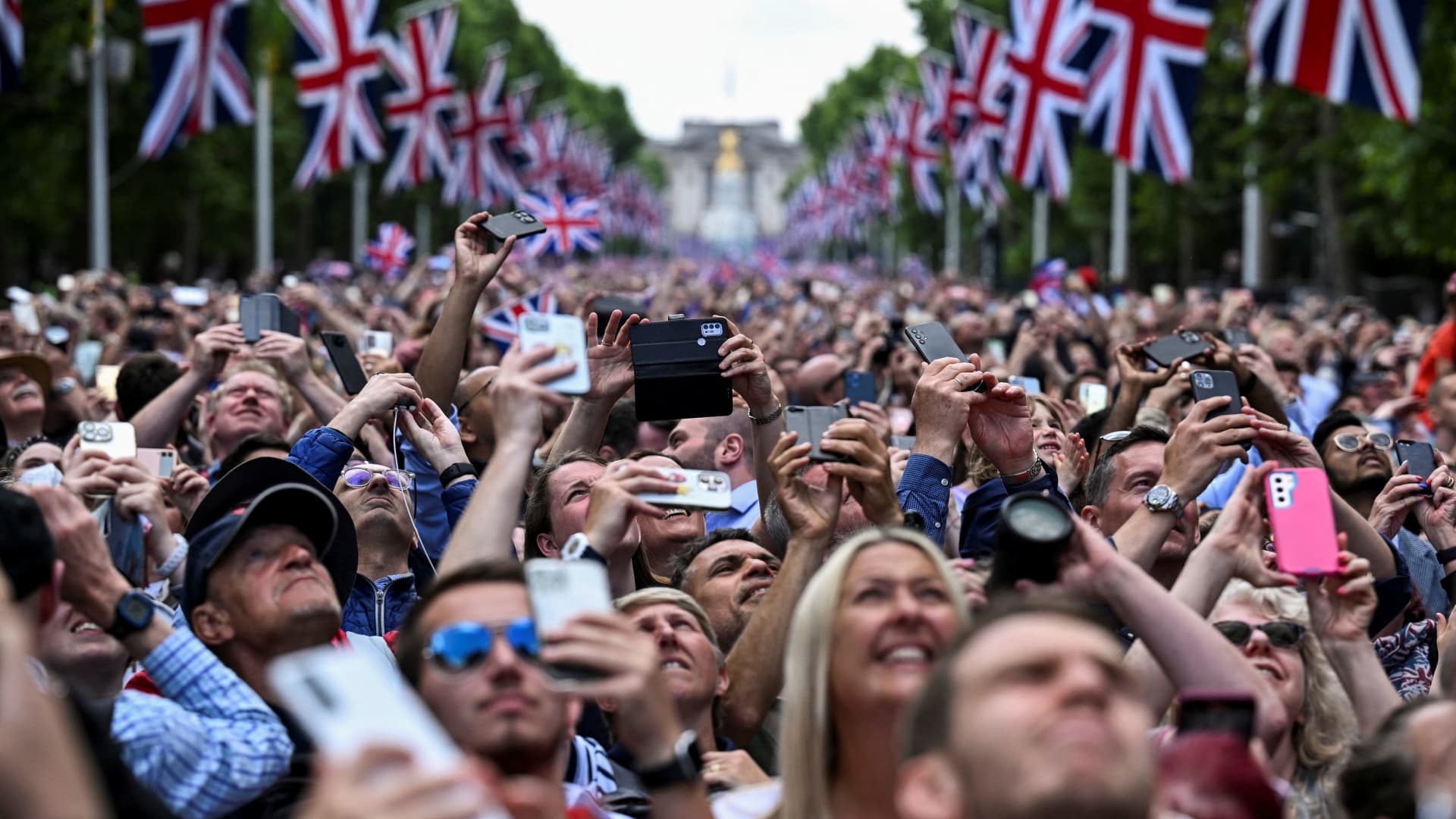 People gathered on The Mall watch a fly-past over Buckingham Palace during celebrations marking the Platinum Jubilee of Britain's Queen Elizabeth, in London, Britain, June 2, 2022. 