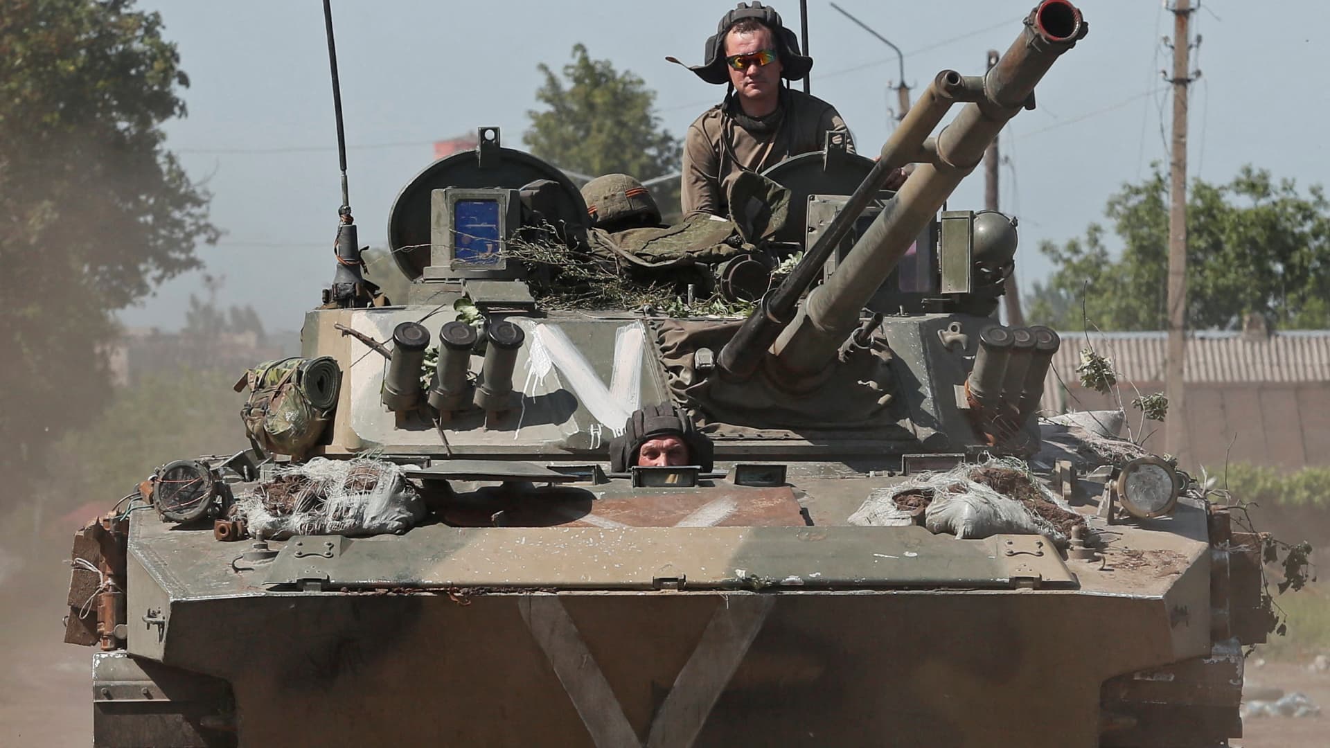 Service members of pro-Russian troops ride an infantry fighting vehicle during Ukraine-Russia conflict in the town of Popasna in the Luhansk Region, Ukraine June 2, 2022.