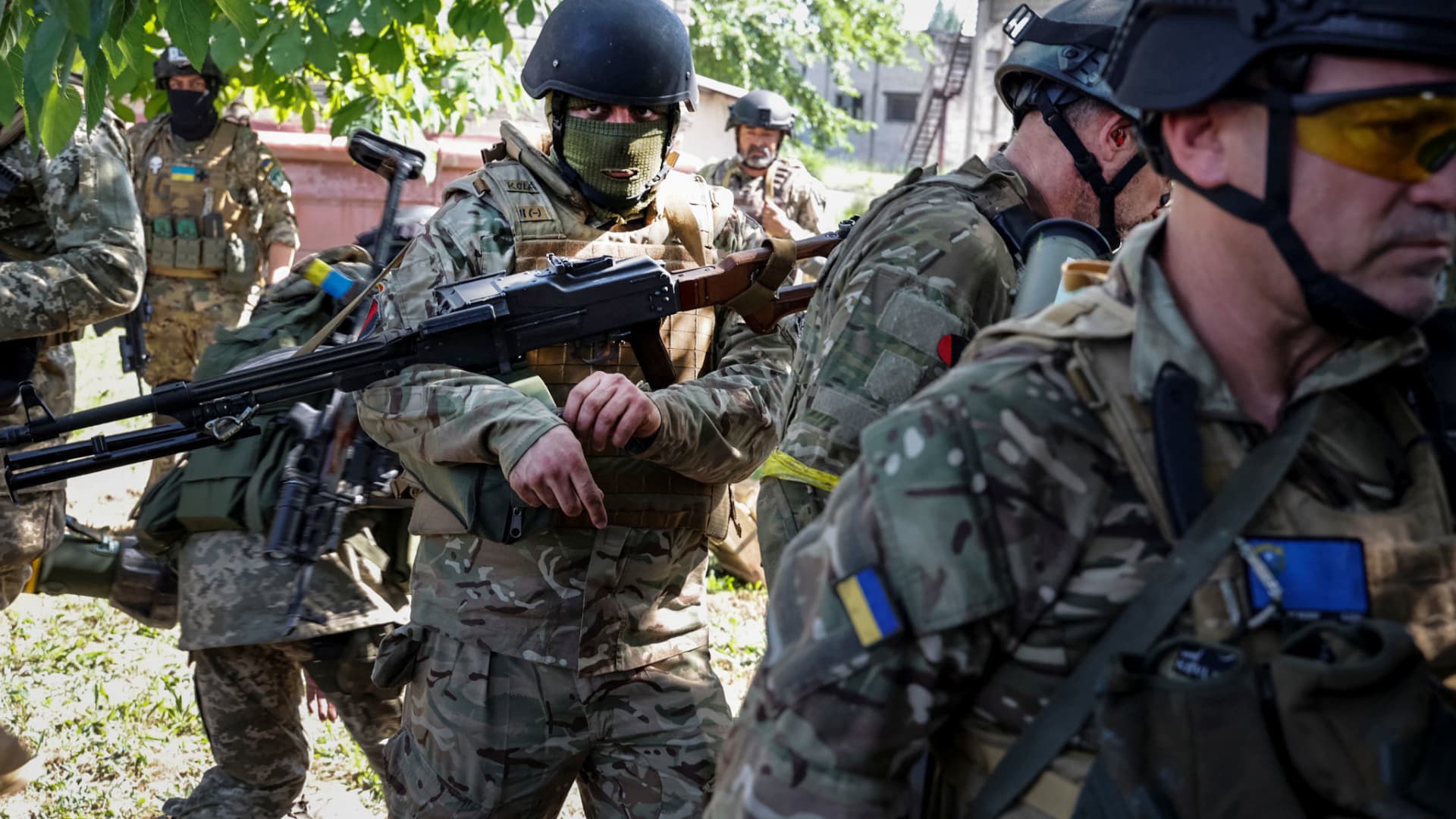 Members of foreign volunteers unit which fights in the Ukrainian army walk, as Russia's attack on Ukraine continues, in Sievierodonetsk, Luhansk region Ukraine June 2, 2022.
