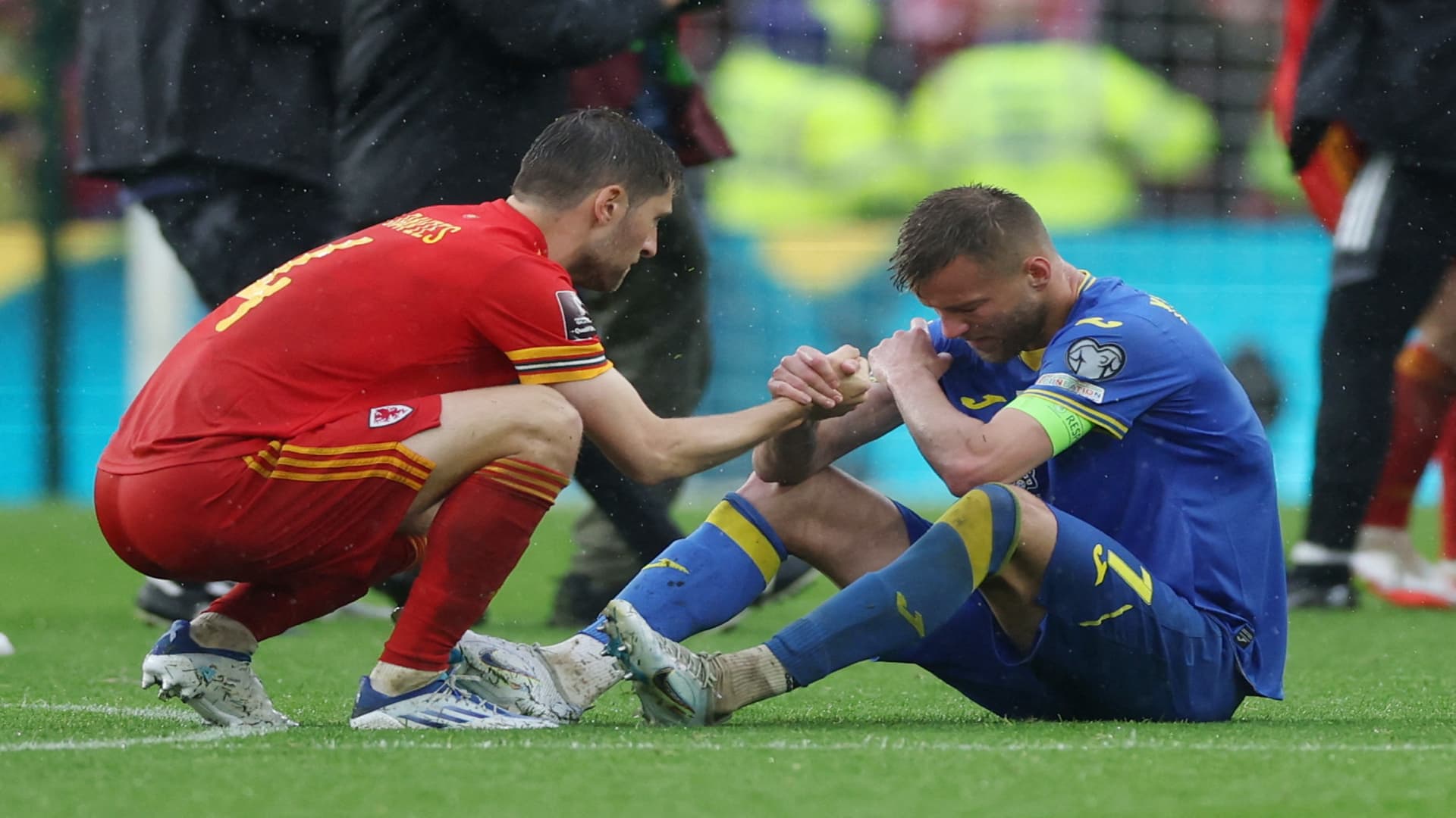 Wales' Ben Davies consoles Ukraine's Andriy Yarmolenko after the match on June 5, 2022.