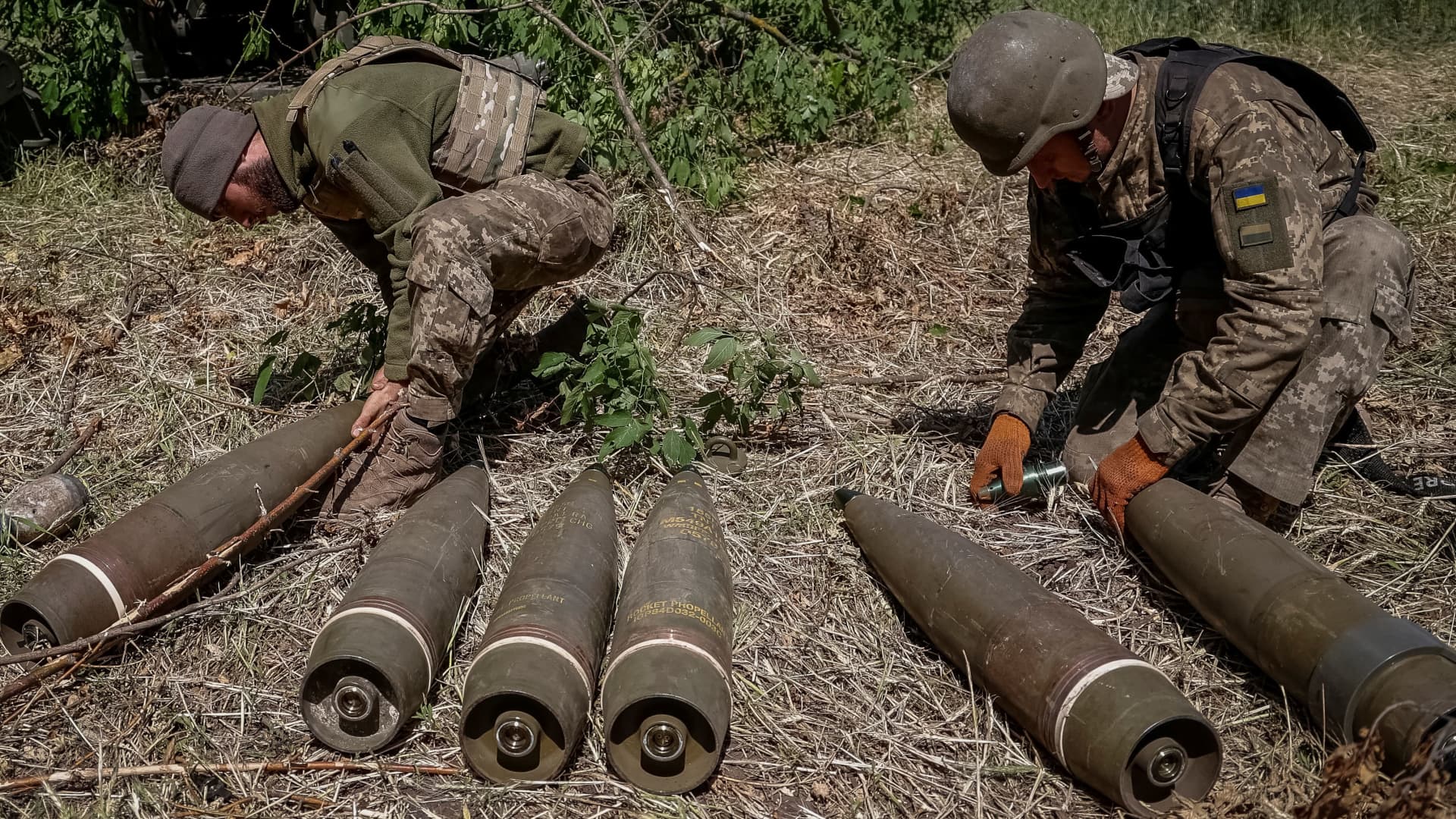 Ukrainian service members ready shells to be used in a M777 Howitzer near a frontline, in Donetsk Region, Ukraine June 6, 2022.
