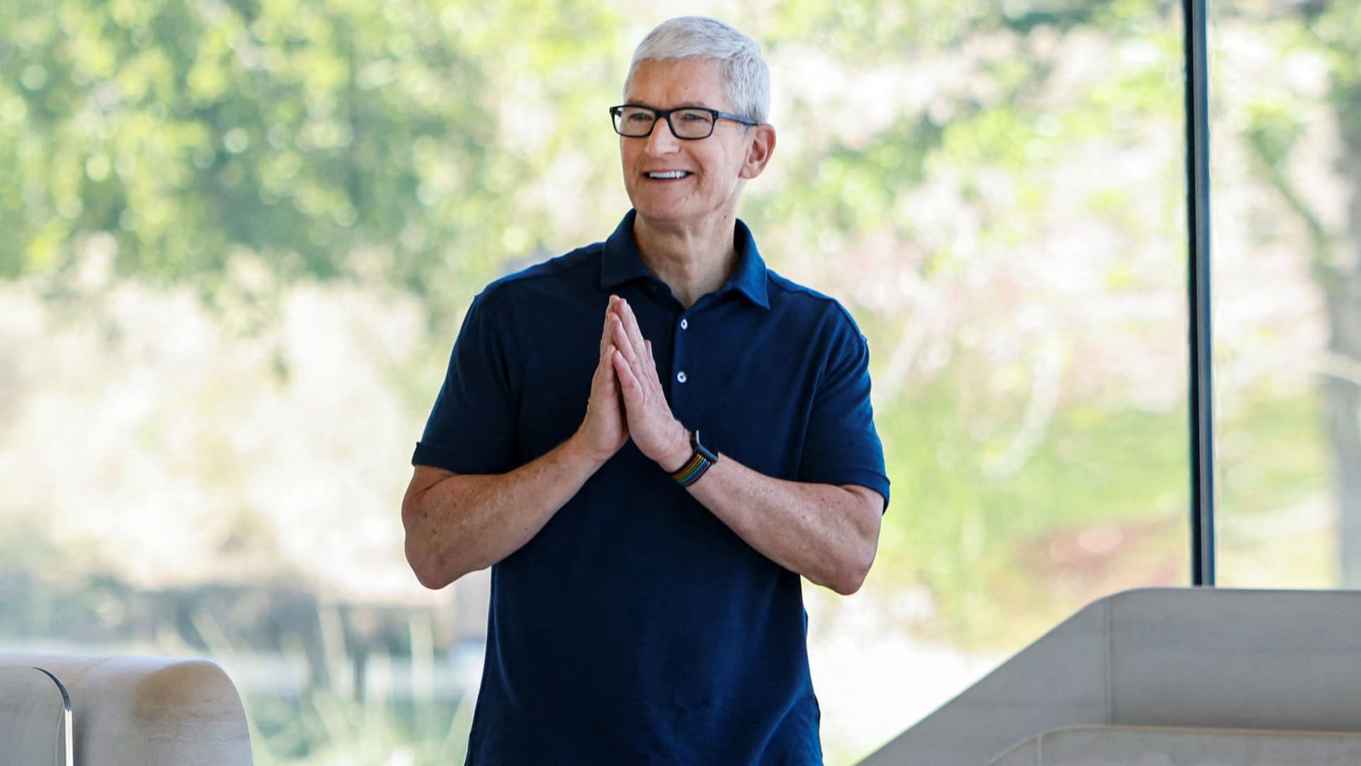 Apple CEO Tim Cook walks during Apple's annual Worldwide Developers Conference in San Jose, California, June 6, 2022.