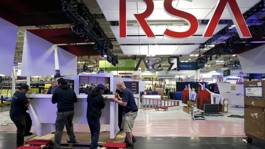 A construction crew assembles a display for the RSA Conference at Moscone Center in San Francisco, Calif.